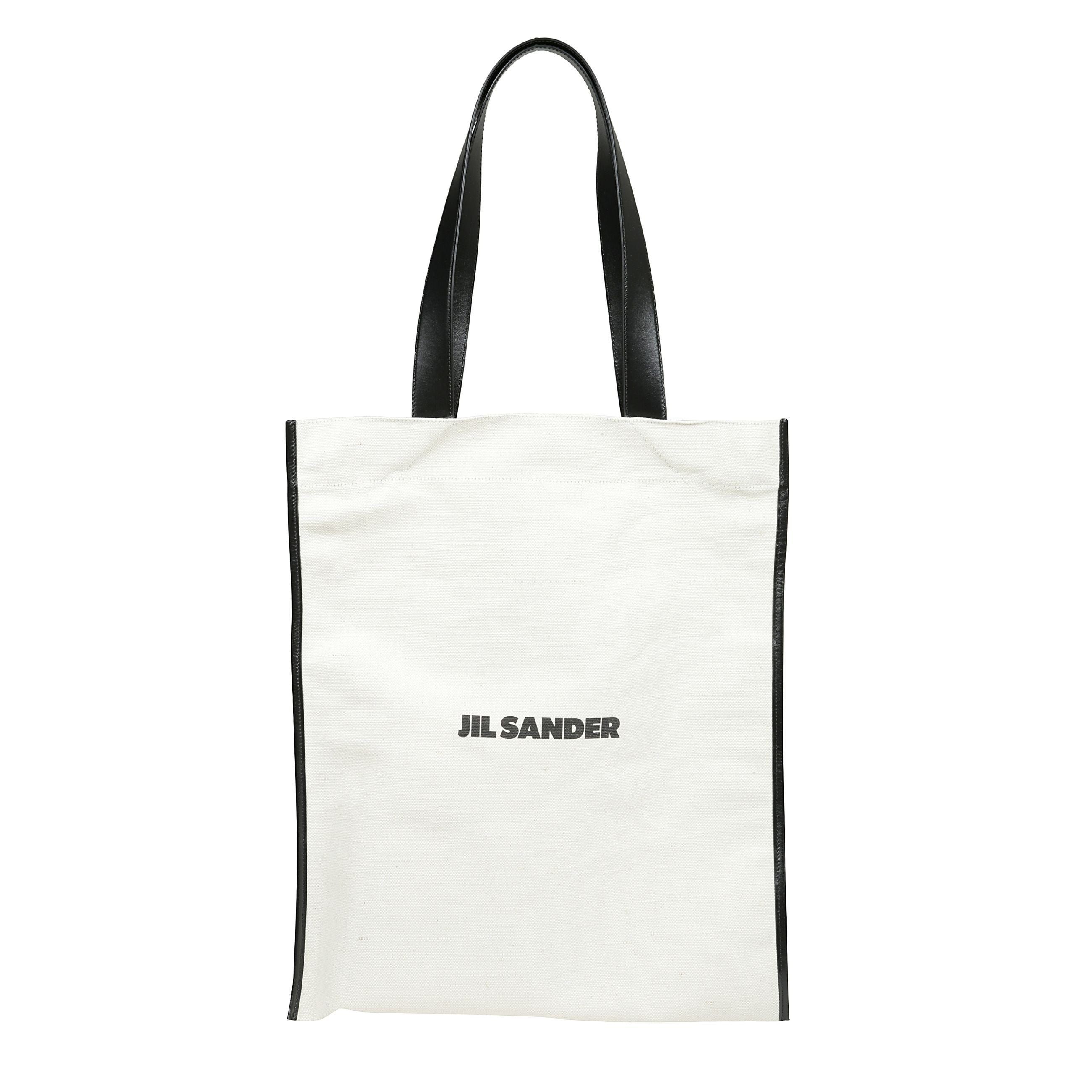 Borsa shopper media in misto cotone beige e nero con design rettangolare, ha due manici in pelle sulla parte superiore, una
tasca interna in pelle con lo scomparto interno per banconote
in tela in lino e cotone, stampa logo sul davanti.