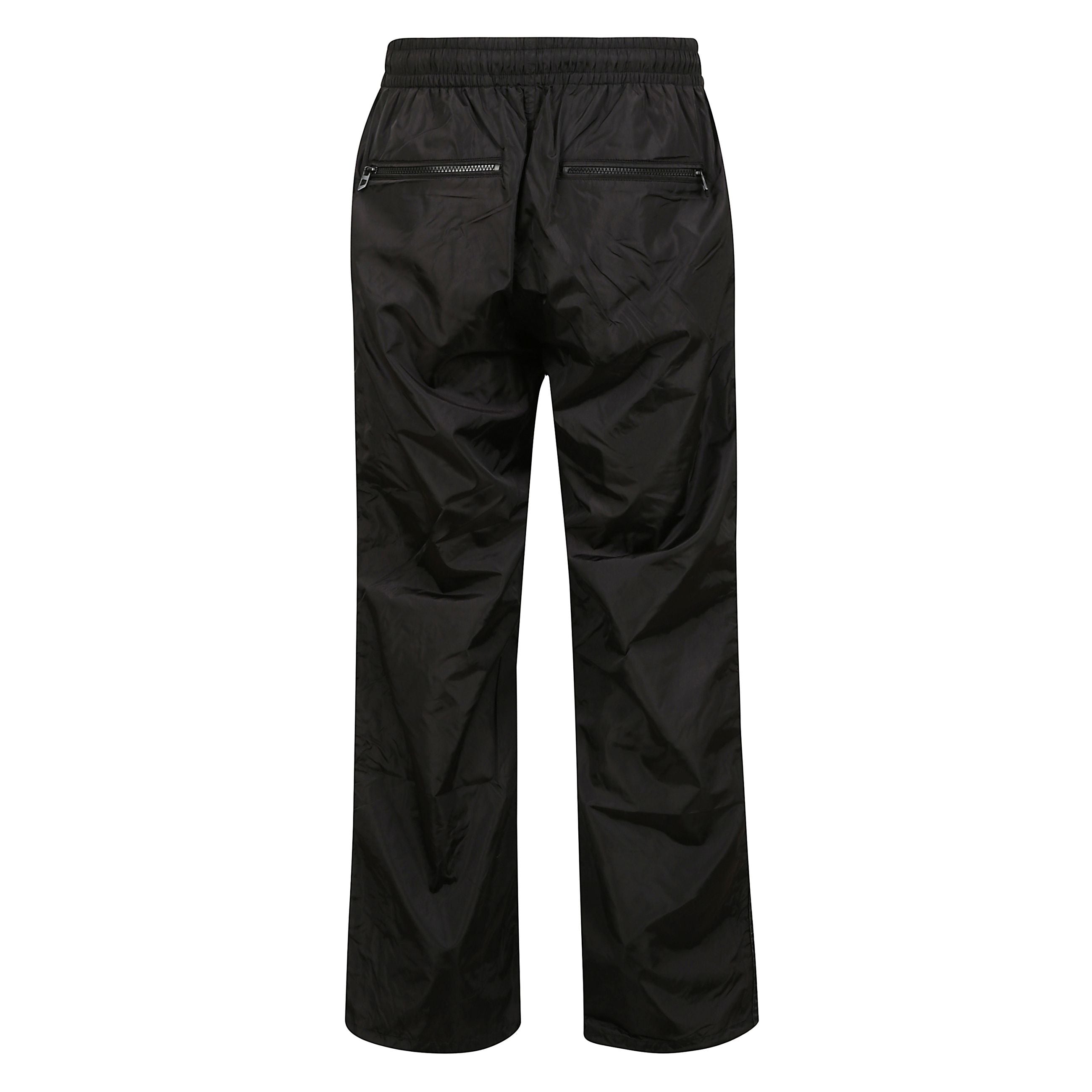 Pantaloni sportivi p-caron, vita elasticizzata
e due tasche posteriori con zip