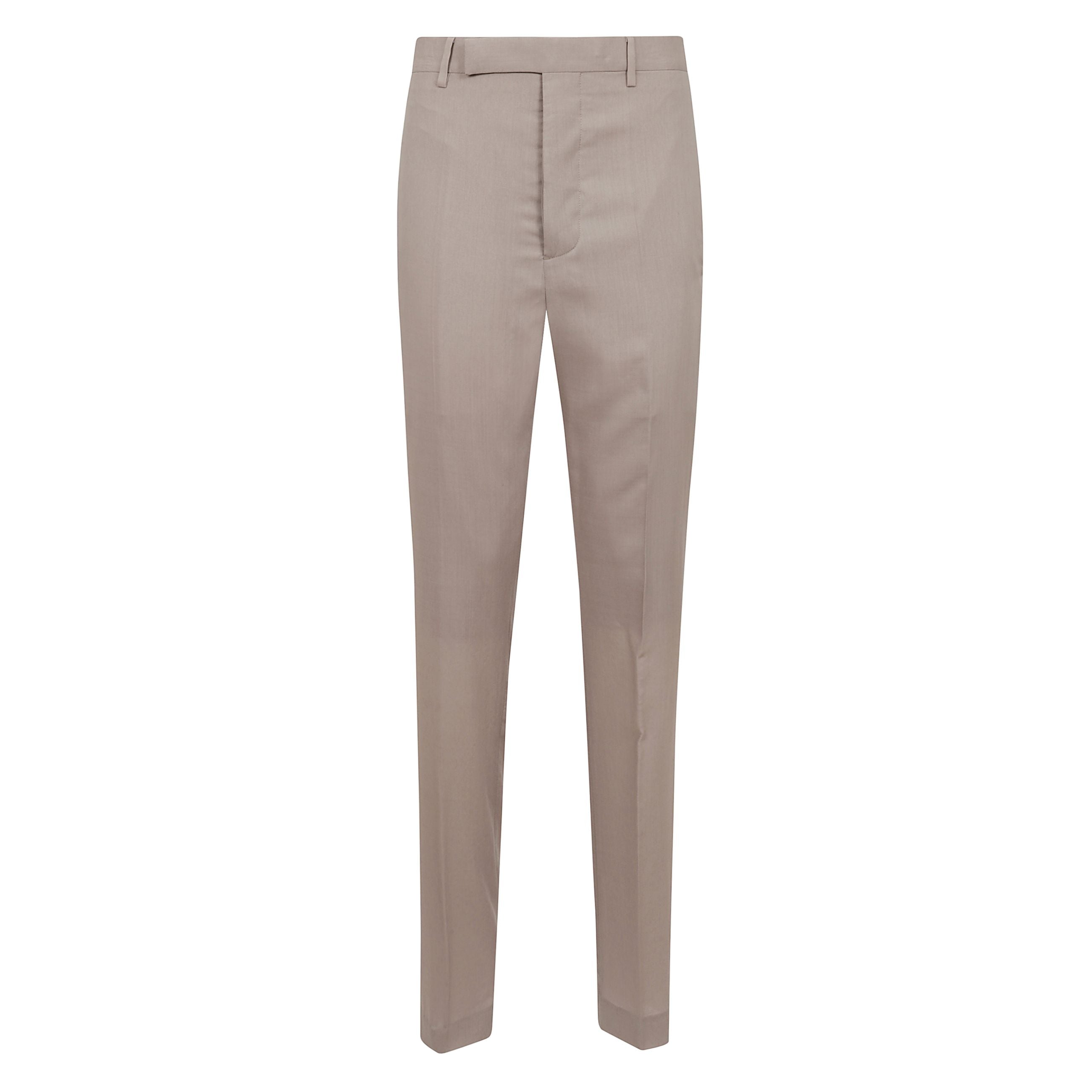 Un'eleganza minimalista e sofisticata definisce questi pantaloni firmati rick owens, realizzati in una pregiata lana vergine stretch che garantisce comfort e vestibilità impeccabile. il taglio sartoriale slim valorizza la silhouette con linee pulite e ra