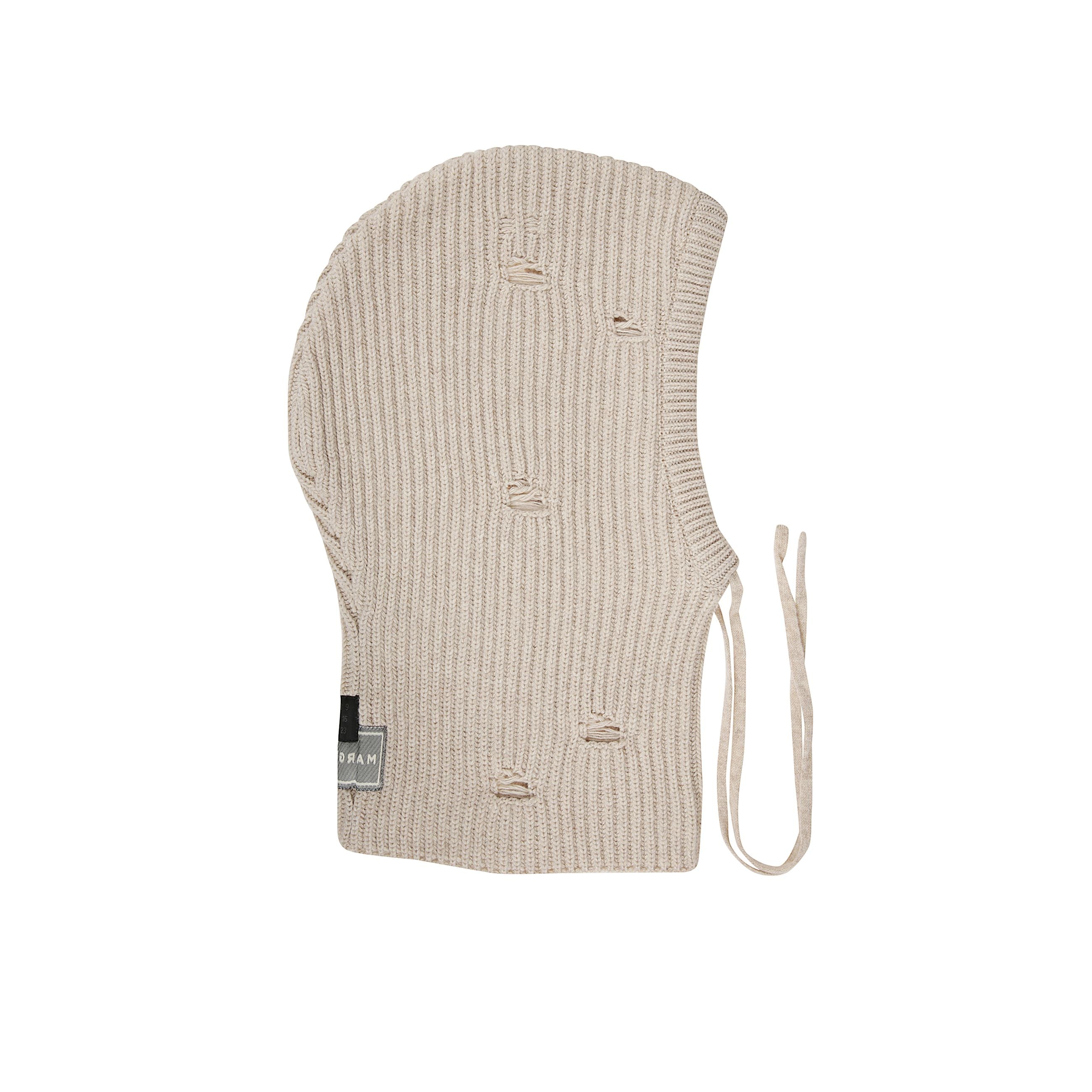 Cappello in maglia. texture lavorata. risvolto turn-up. dettagli del logo maison margiela in evidenza. elementi con effetto vissuto.