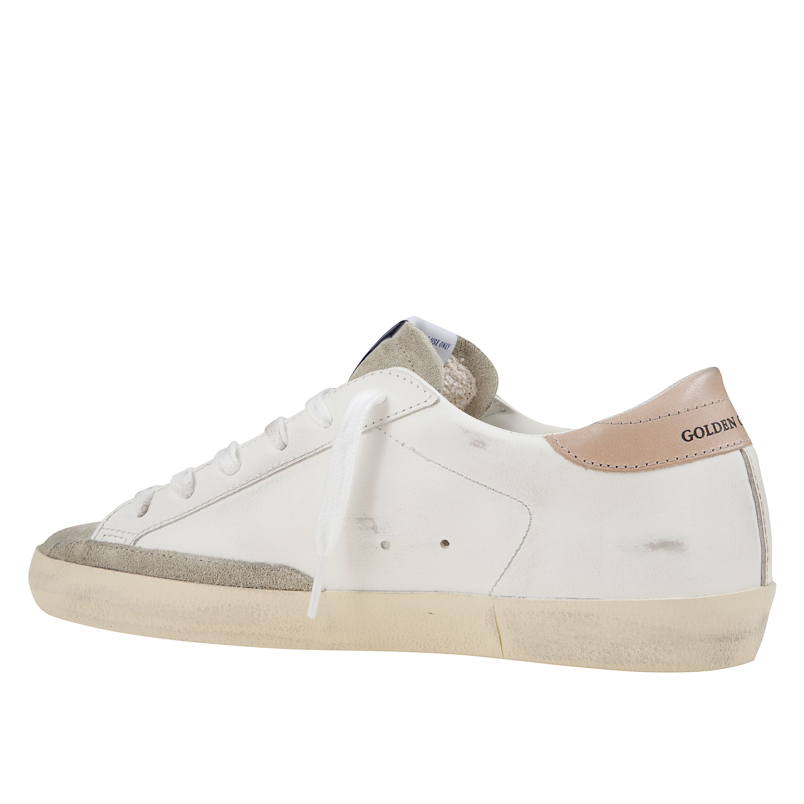 Sneaker donna in pelle bianca con suola in gomma e chiusura con lacci. stella nera sul lato con effetto glitter e paillettes. tallone a contrasto rosa. punta in suede grigio.