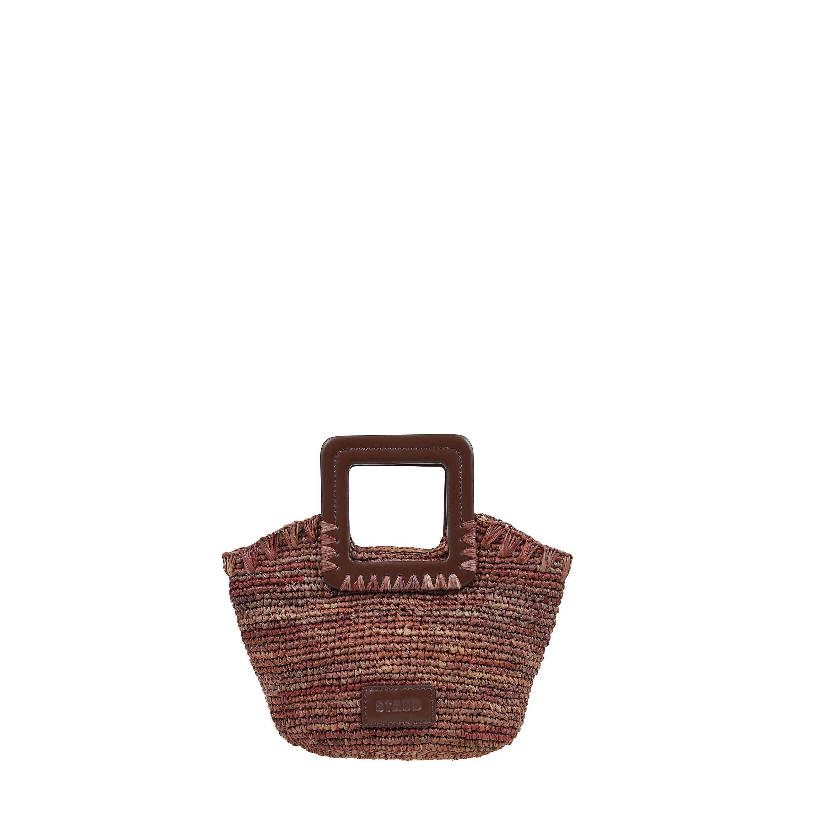 Borsa a mano shirley mini in raffia con chiusura magnetica nascosta e manici corti ha la tracolla regolabile e rimovibile.
