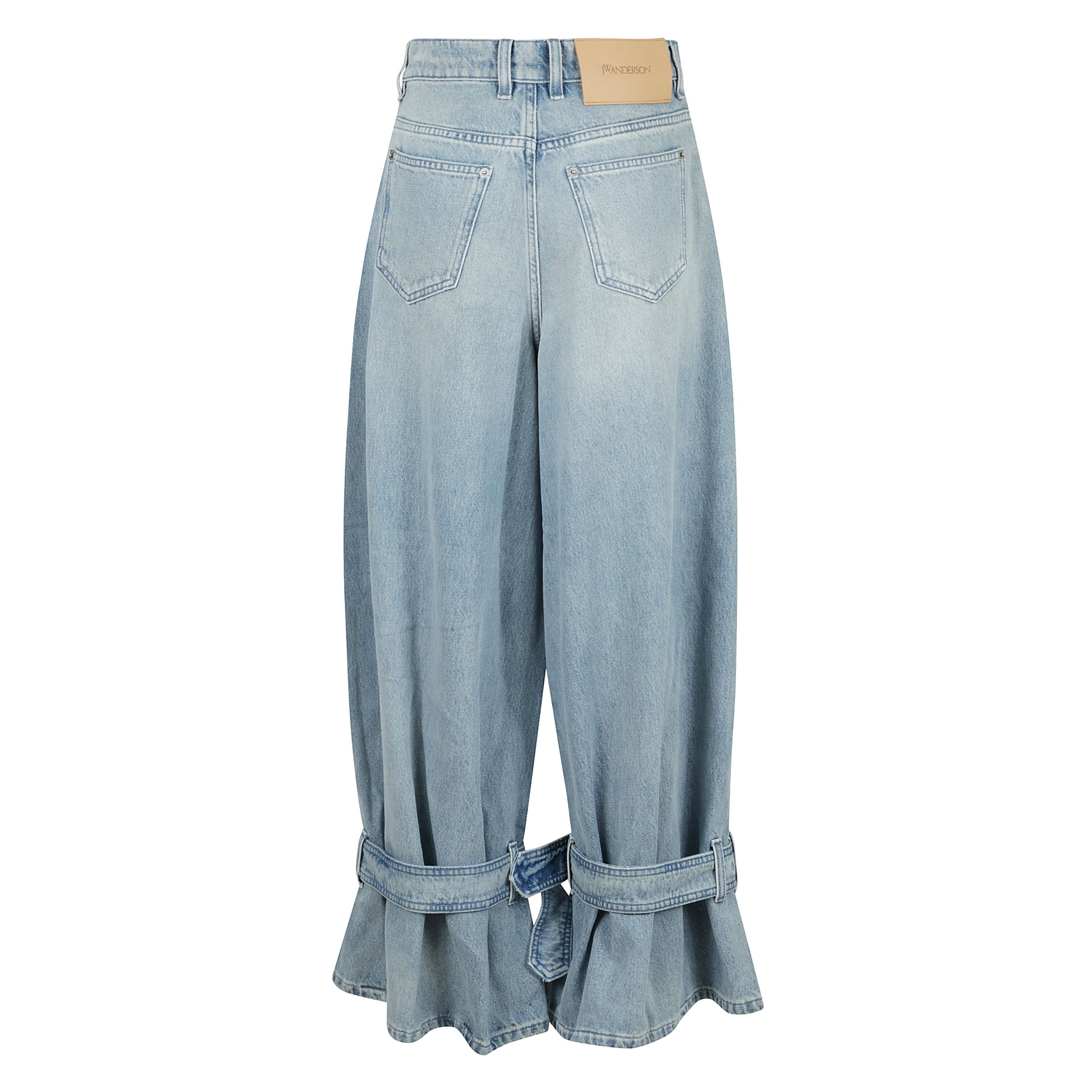 Buckled cuff jeans a gamba larga con chiusura frontale con bottone e cerniera nascosta