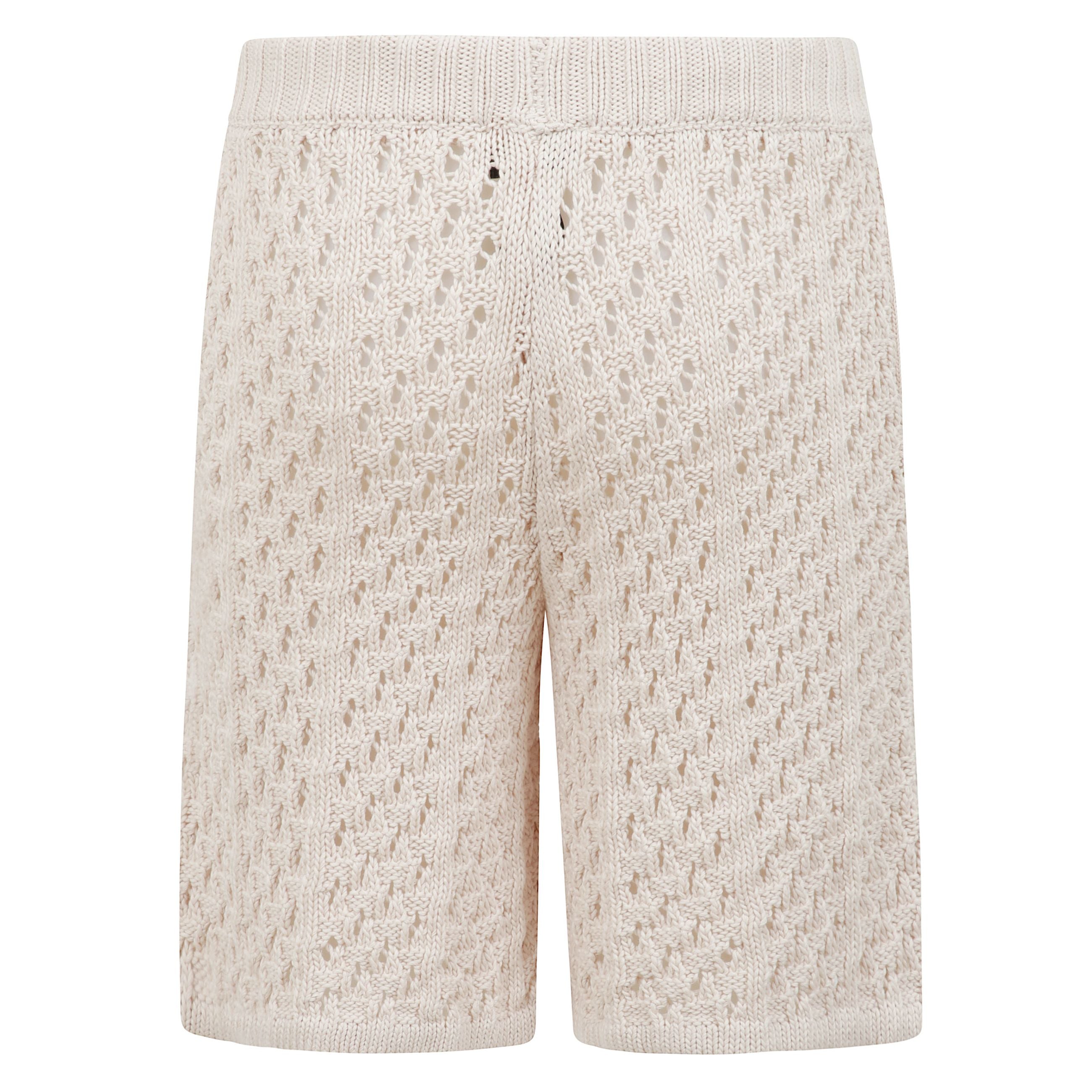Shorts crochet in filato di cotone presenta una vita a coste con coulisse regolabile.