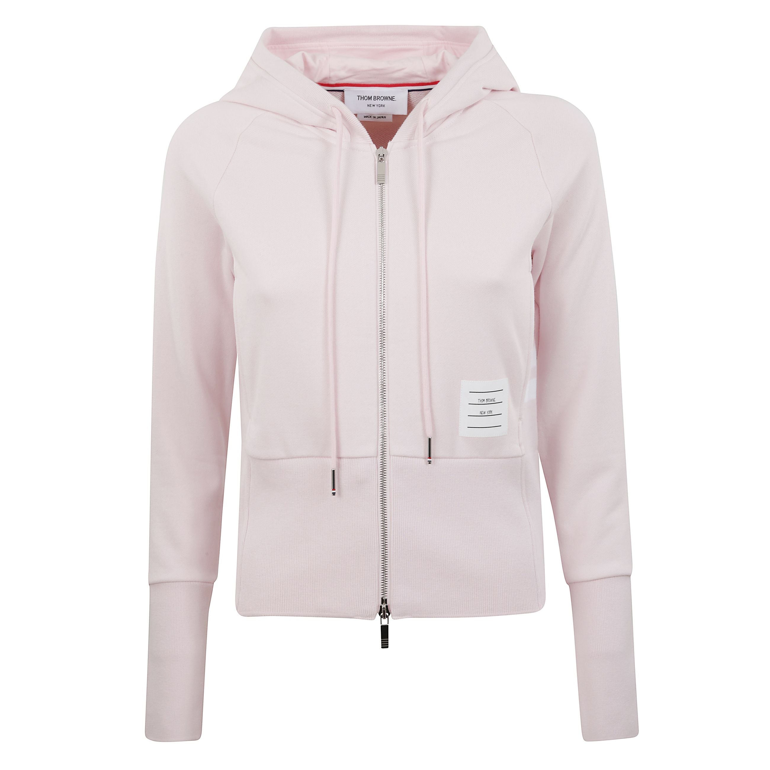 Felpa con cappuccio regolabile tramite coulisse e chiusura a zip argentata a doppio cursore. dettaglio iconico a 4 strisce sul braccio sinistro. tasca frontale a marsupio con etichetta che riporta la firma tom browne.