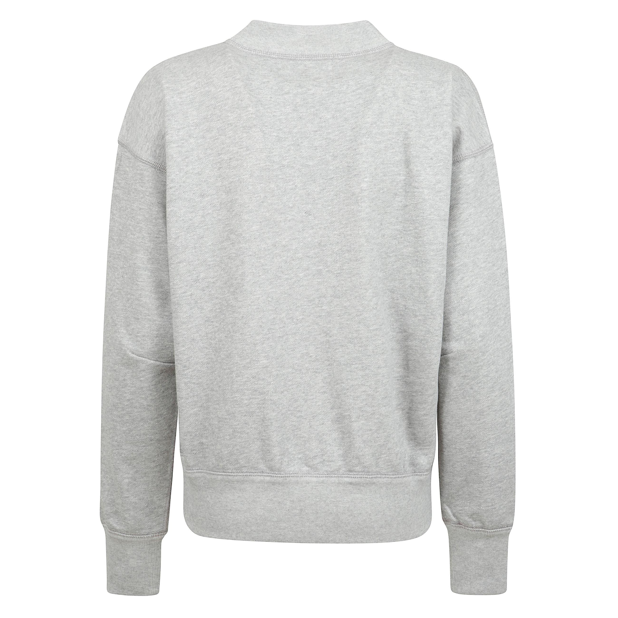 Comfort e stile si fondono in questa felpa firmata isabel marant, realizzata in un morbido tessuto felpato misto cotone. il design è valorizzato da un collo alto rotondo con dettaglio a v, maniche lunghe e finiture a coste che donano struttura al capo.
i