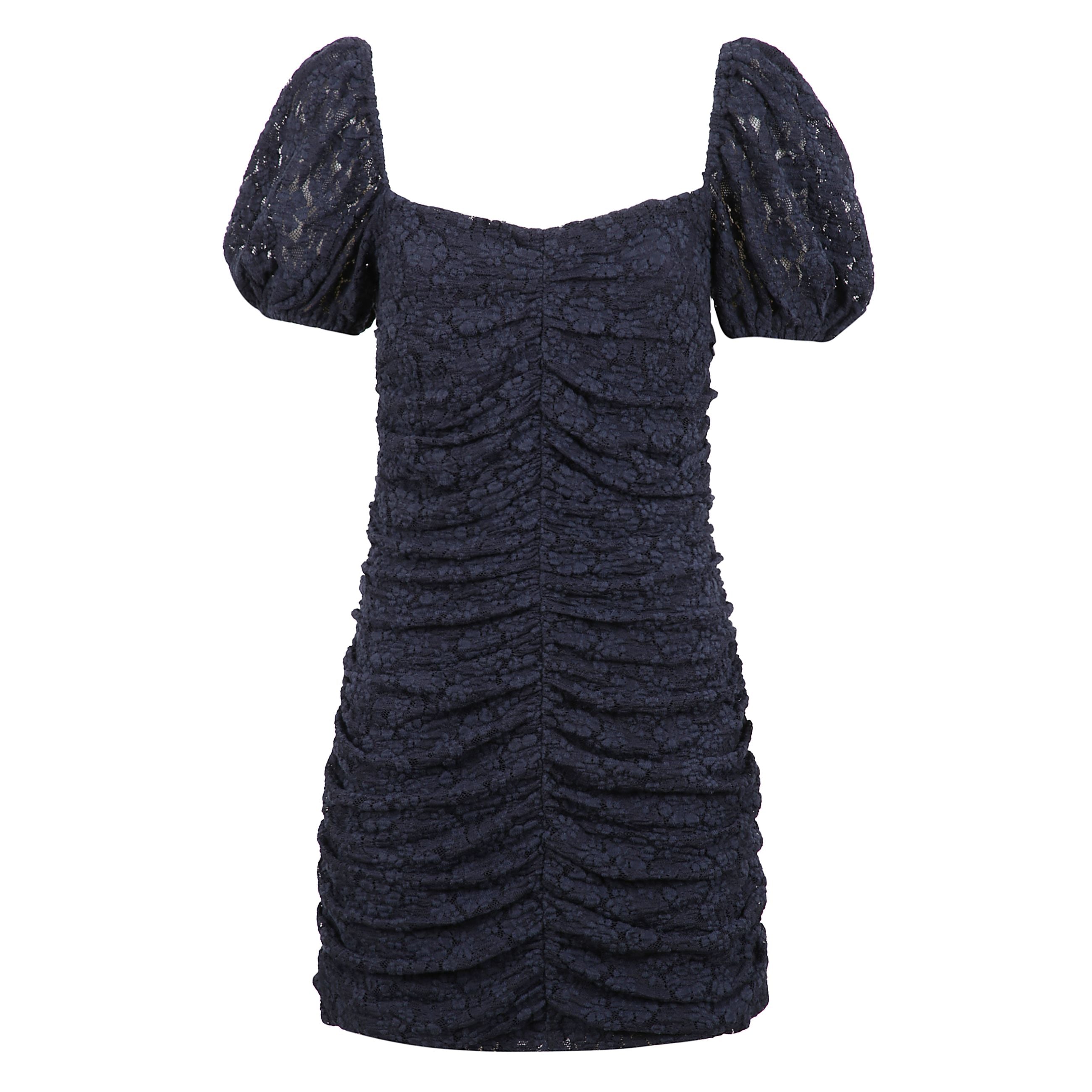 Abito corto con pizzo tema floreale e maniche a palloncino.