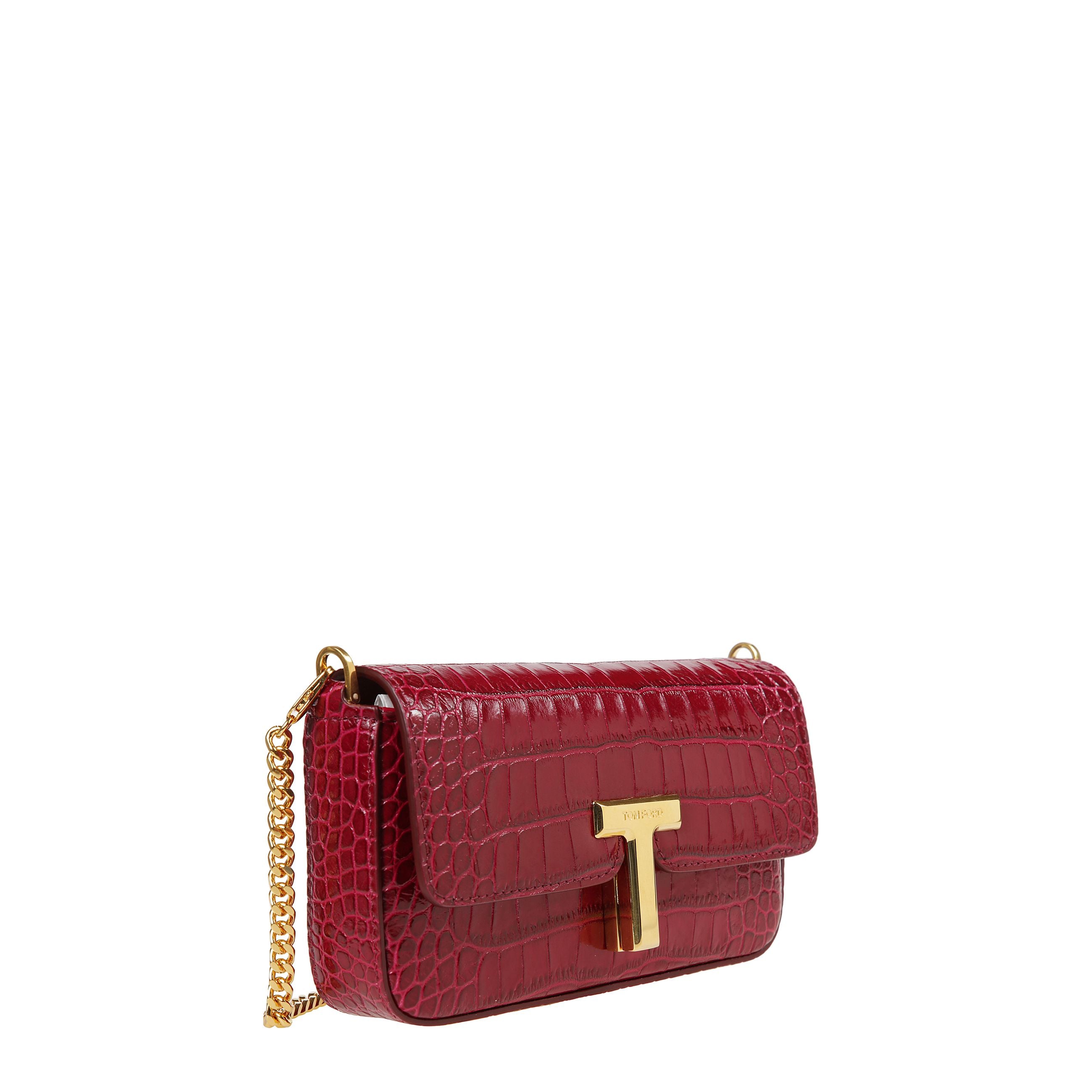 Borsa a tracolla in pelle di vitello lucida a stampa coccodrillo con patta superiore e chiusura a t in metallo con logo inciso