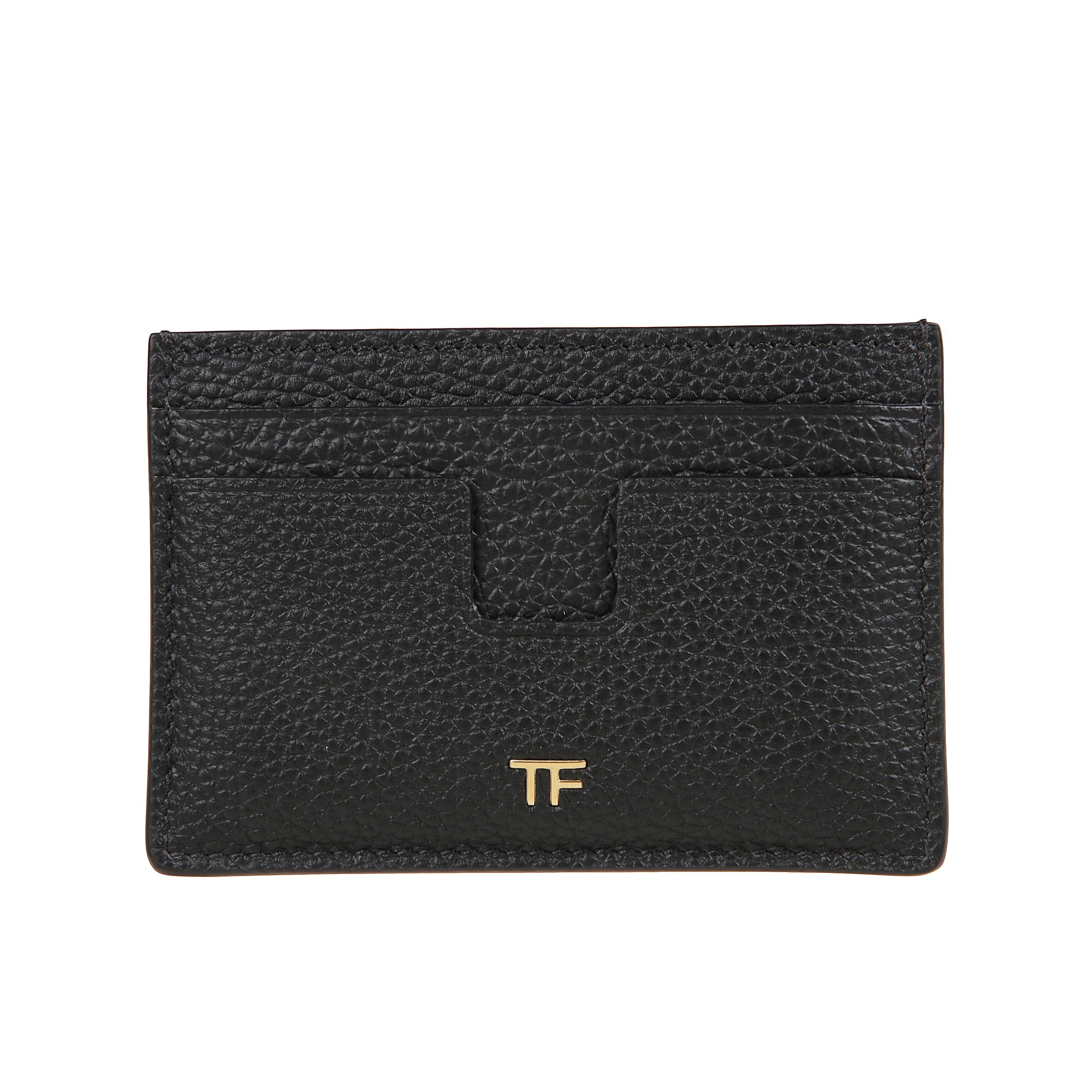 Portacarte in pelle dal design compatto ed elegante con bordi smussati. fessure per tessere multiple e logo a contrasto con monogramma tf, distintive del brand tom ford.
