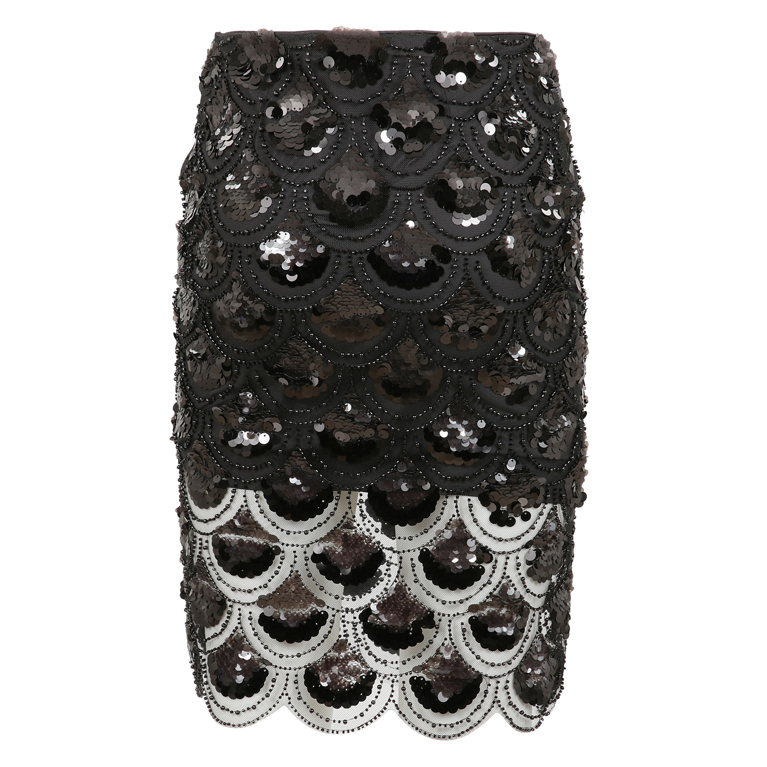 Gonna realizzata in tessuto con paillettes con inserti in pizzo