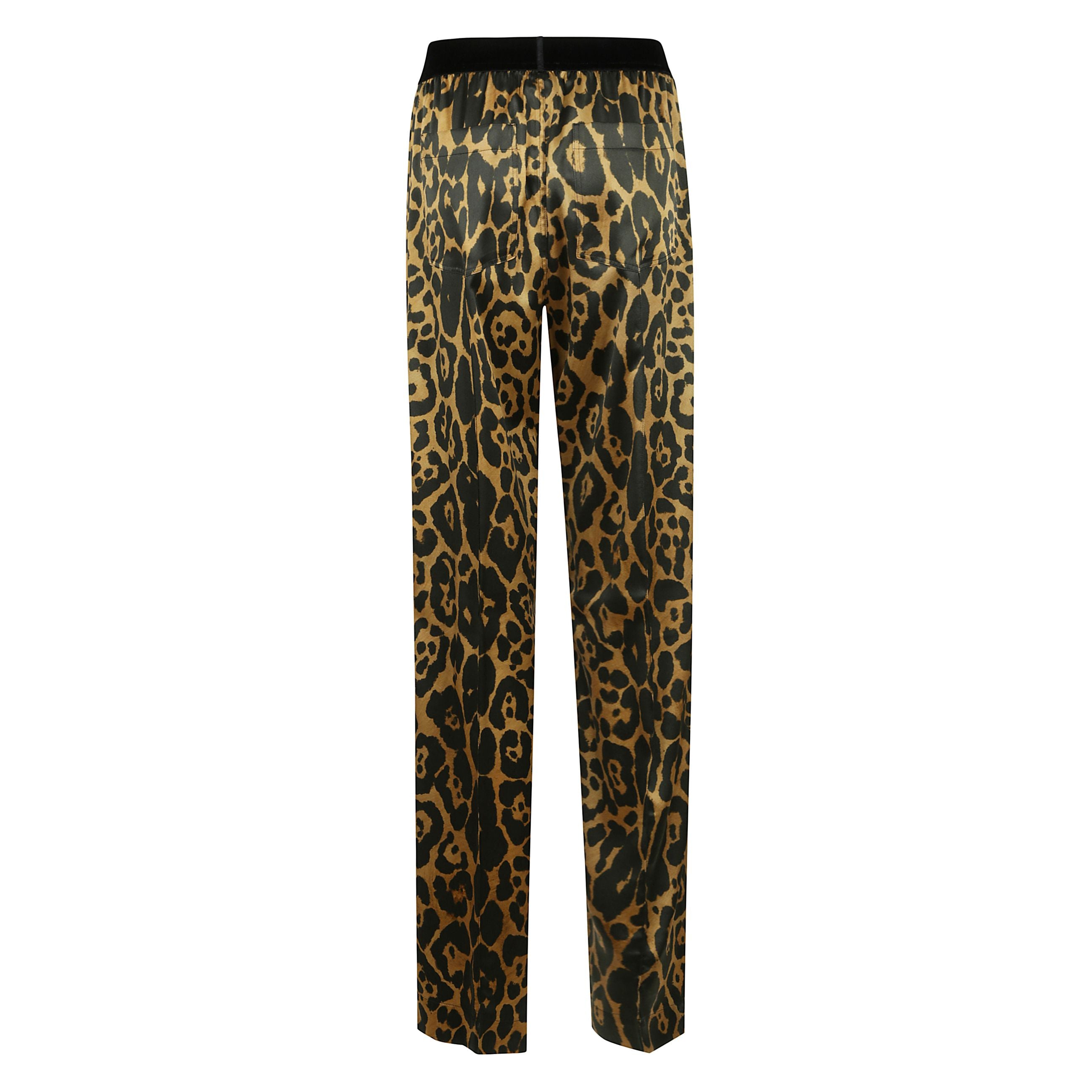 Pantaloni con stampa animalier, vita elasticizzata in velluto con logo, due tasche laterali oblique e due tasche posteriori applicate