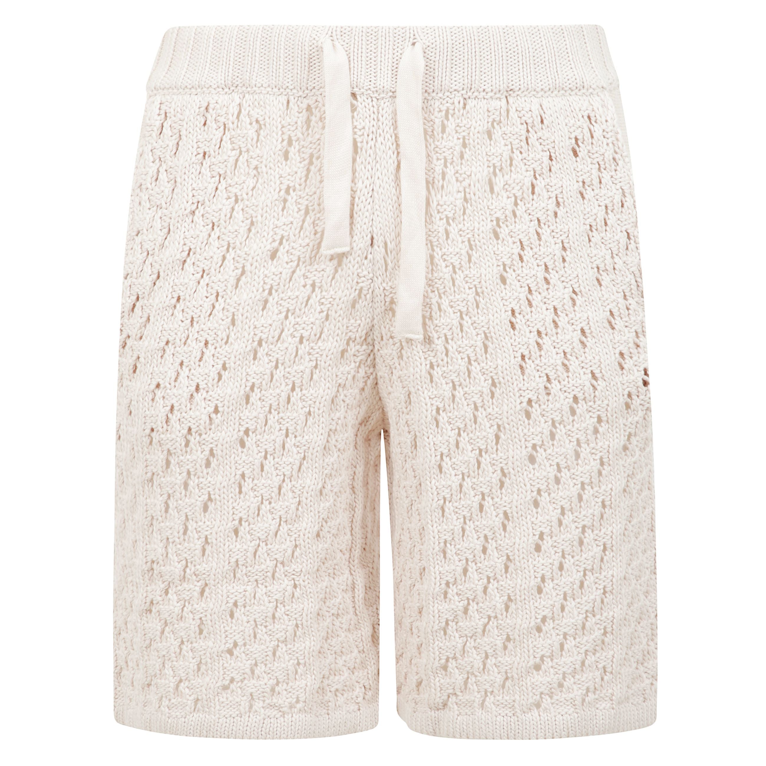 Shorts crochet in filato di cotone presenta una vita a coste con coulisse regolabile.