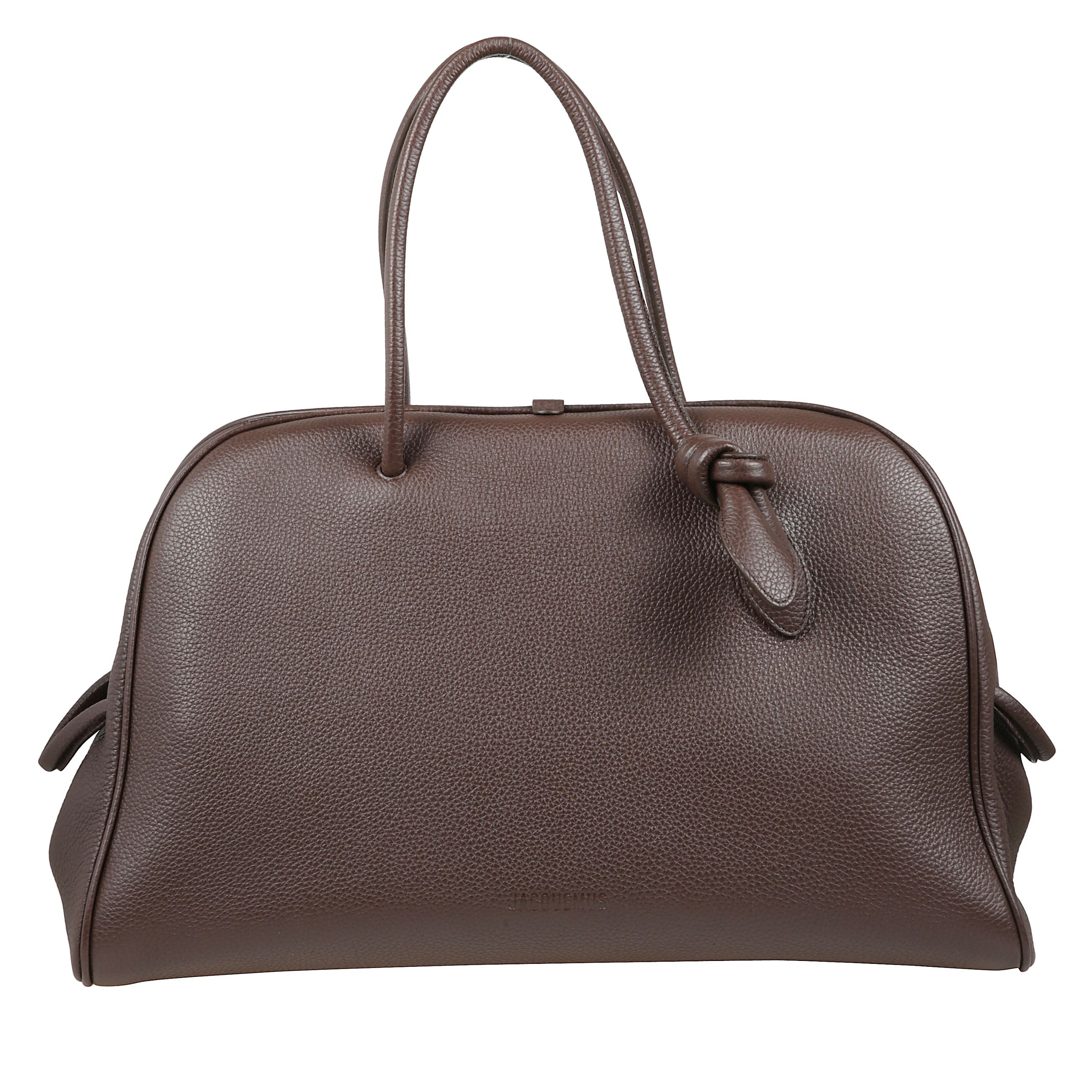 Borsa in pelle martellata. doppi manici superiori. chiusura con zip nascosta. due piccoli passanti decorativi laterali.