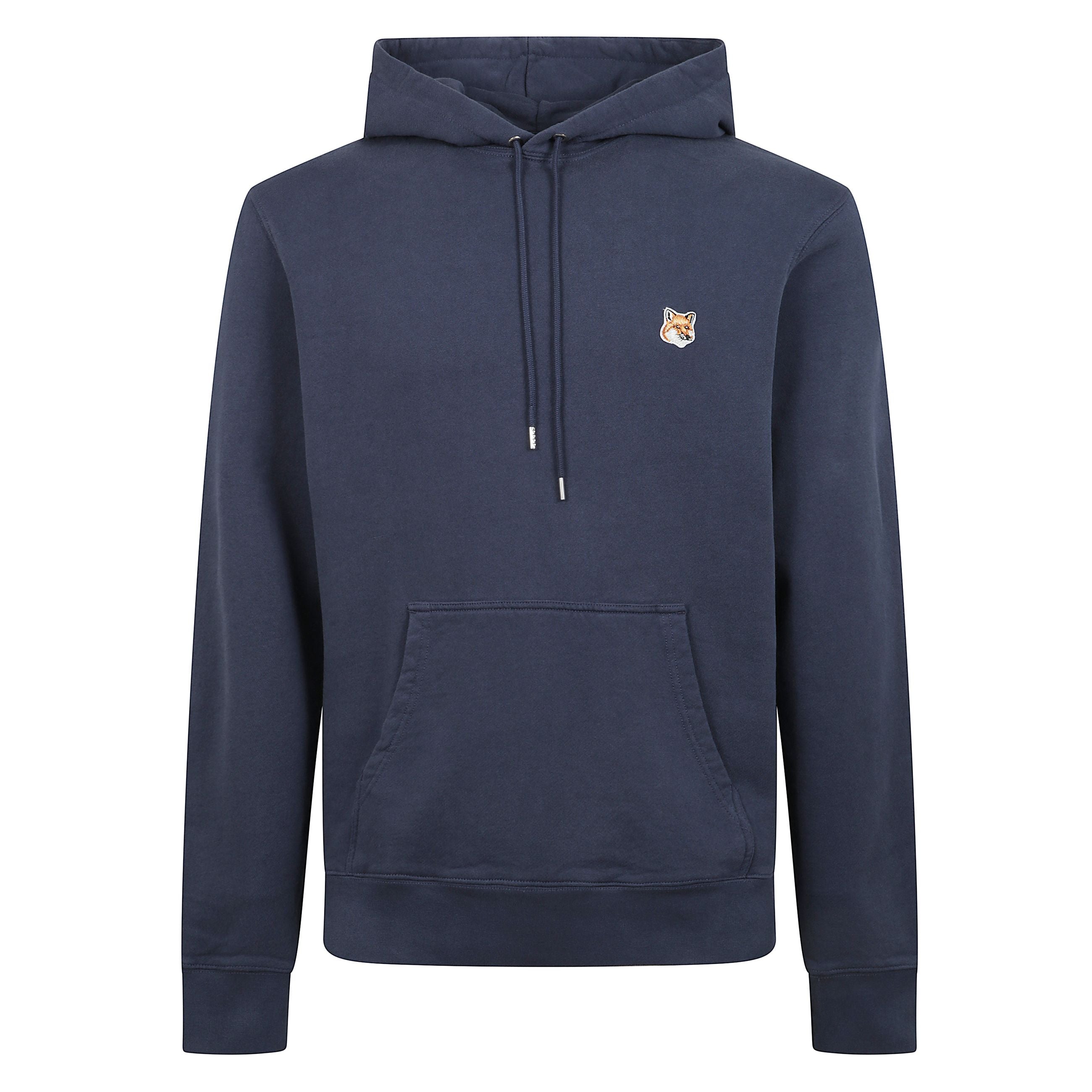 Felpa in cotone a maniche lunghe. taglio classico con toppa fox head ricamata sul petto.