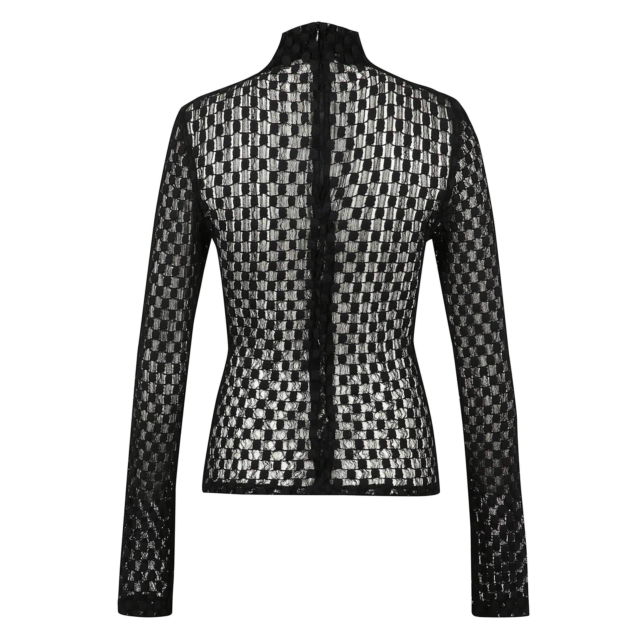 Top dolcevita in pizzo geometrico rifinito con una chiusura centrale posteriore con cerniera cieca