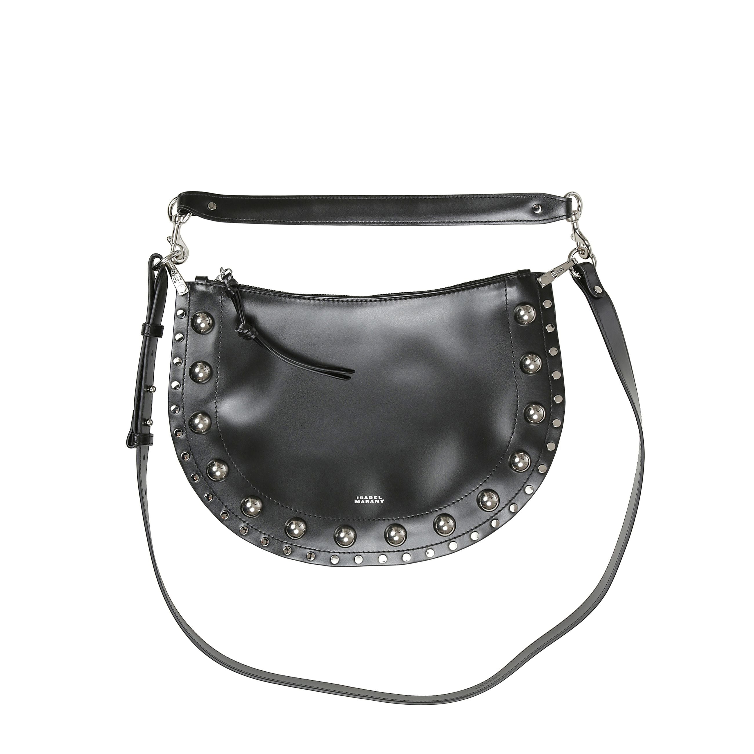 Borsa in pelle di vacchetta liscia borchiata. da portare a mano, a spalla o a tracolla cn manico rimovibile a moschettoni di 34cm.
tracolla regolabile con bottoni a perno
anelli in metallo inciso. bordo ornato da borchie metalliche e chiusura a zip con ti