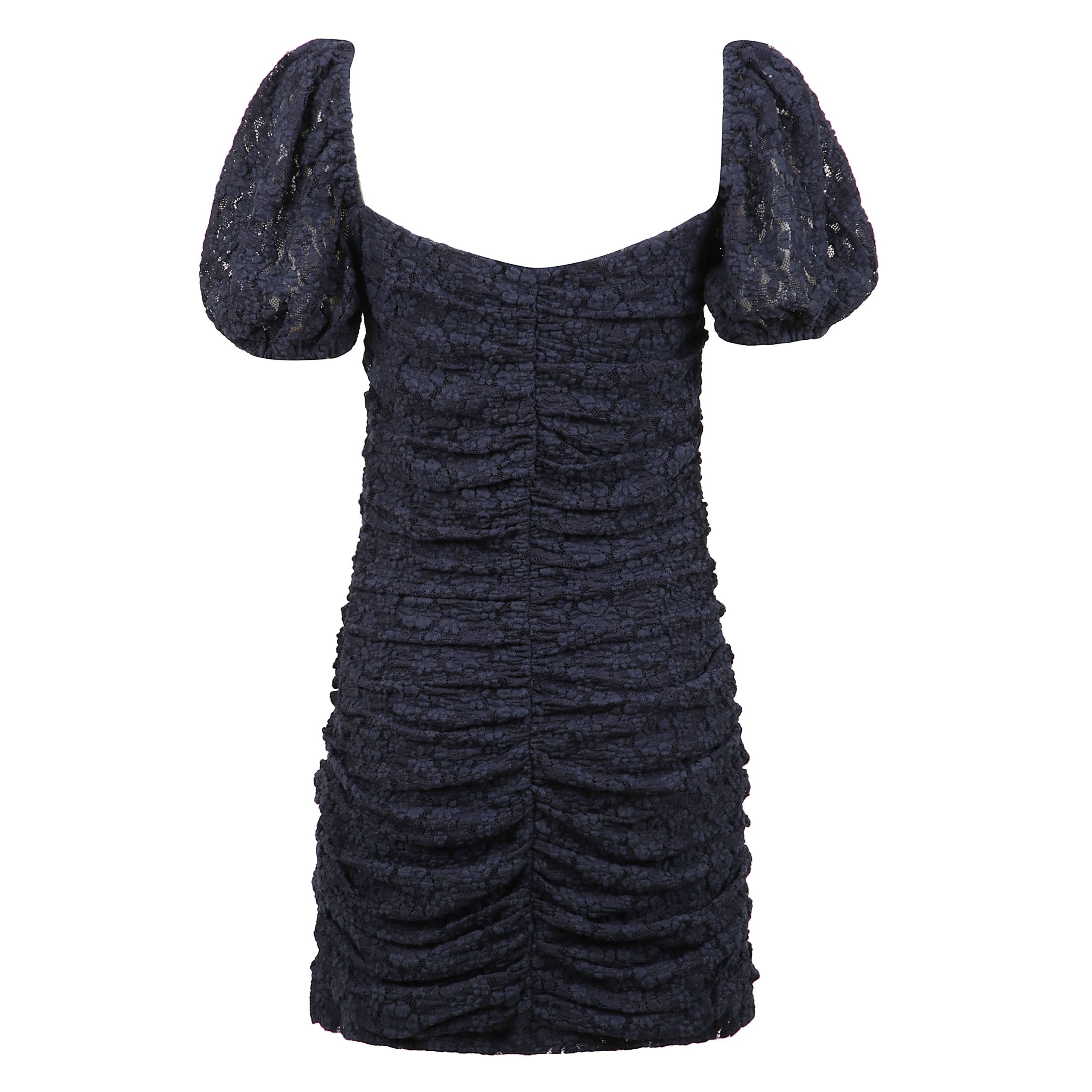 Abito corto con pizzo tema floreale e maniche a palloncino.