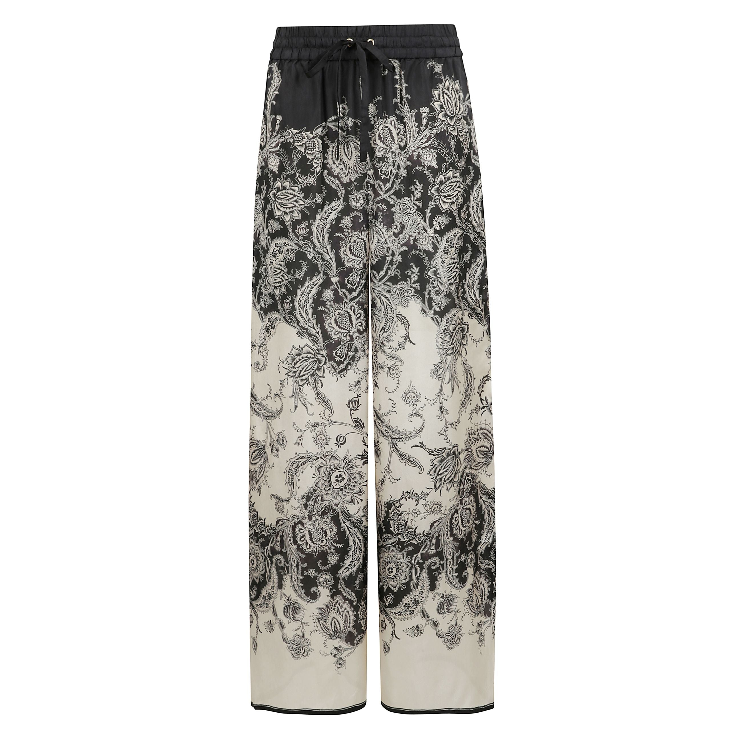 Pantaloni dalla vestibilità comoda rhiannon in crema e nero floreale. pantaloni a vita media in seta habotai dalla silhouette comoda con stampa fantasia e coulisse in vita.