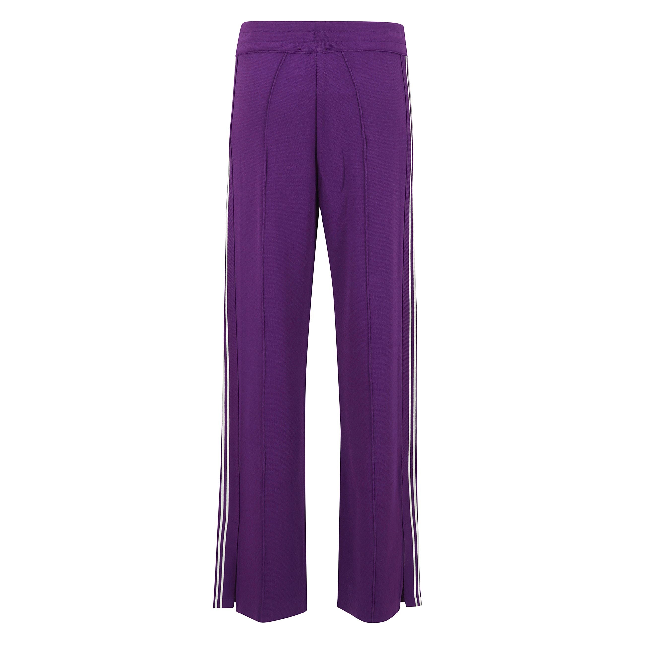 Pantaloni sportivi in maglia a gamba ampia, vita elasticizzata e spacchetti laterali