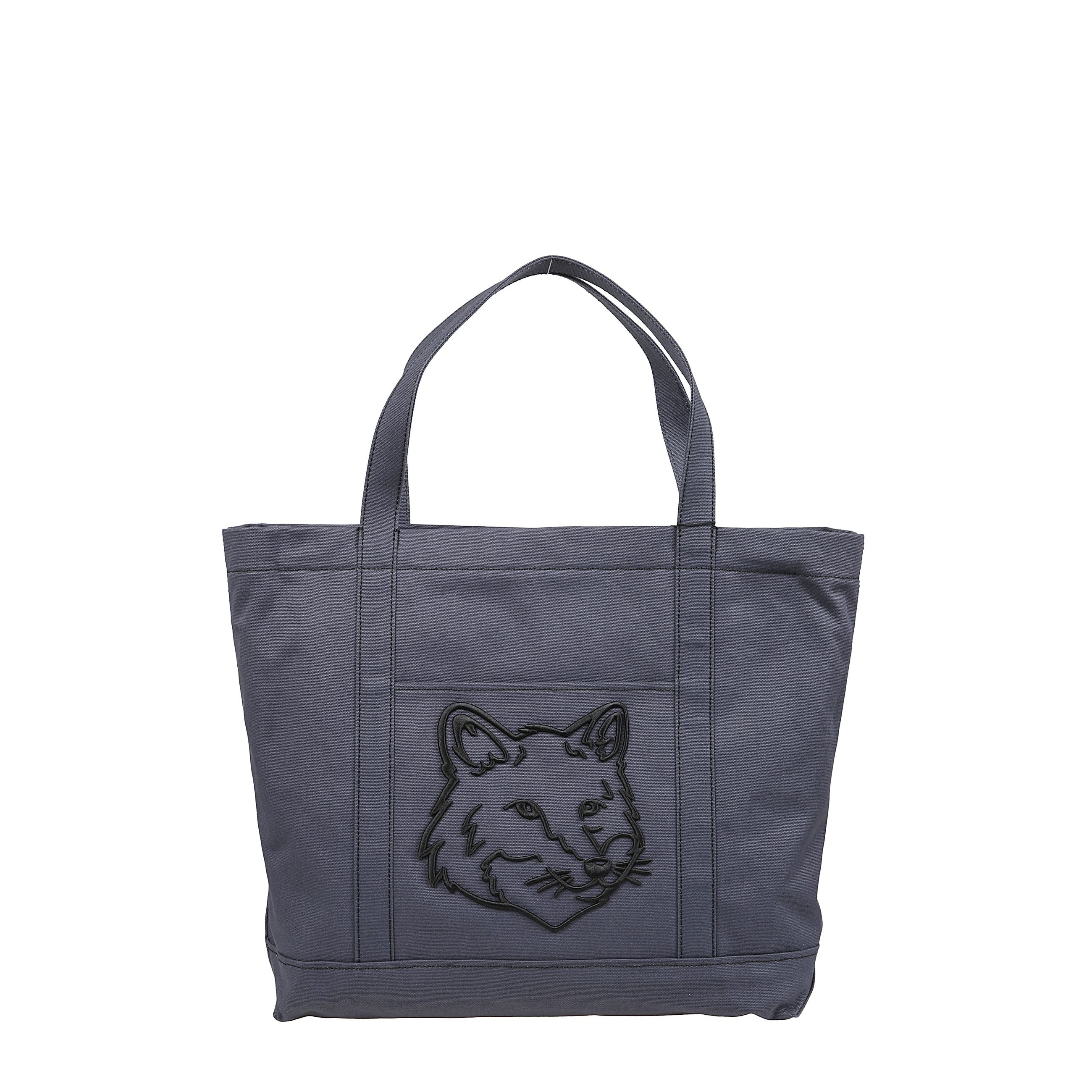 Fox head large tote di maison kitsuné con l'iconica volpe mitica occupa un posto d'onore sul davanti, rifinita con il logo ricamato sul retro.