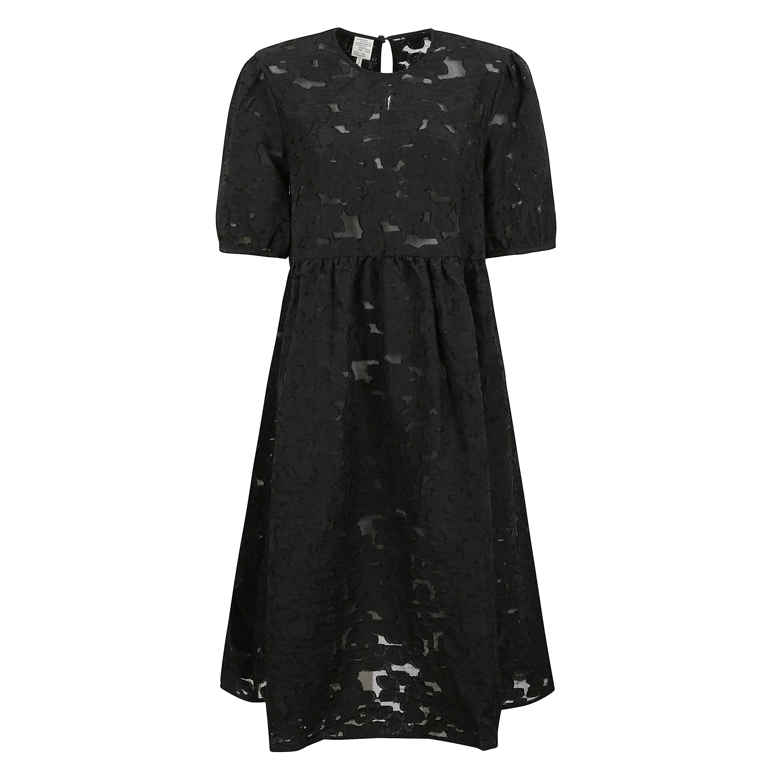 Abito midi semitrasparente realizzato in pizzo floreale, caratterizzato da maniche voluminose