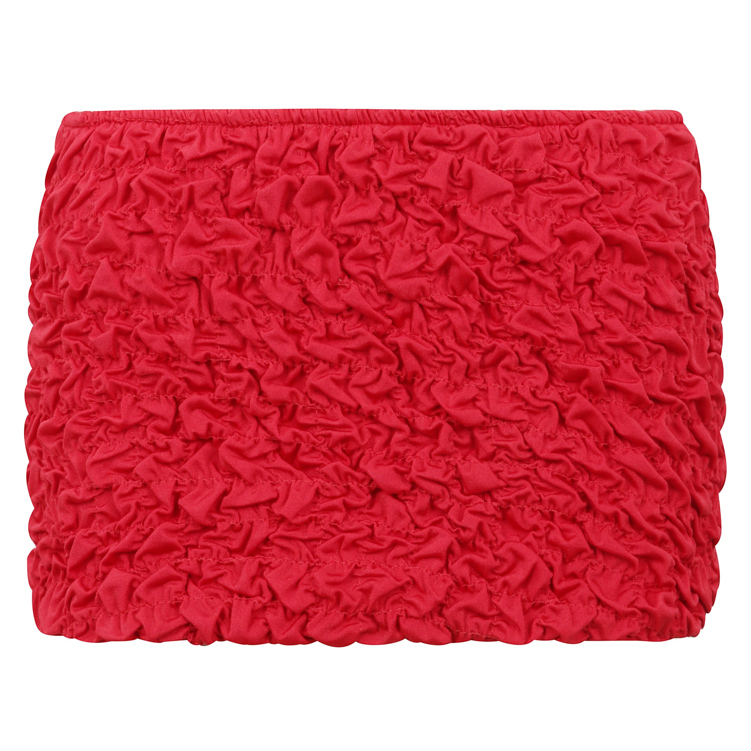 La mini gonna da spiaggia lia è realizzata in tessuto shirring per un drappo perfettamente lussuoso.