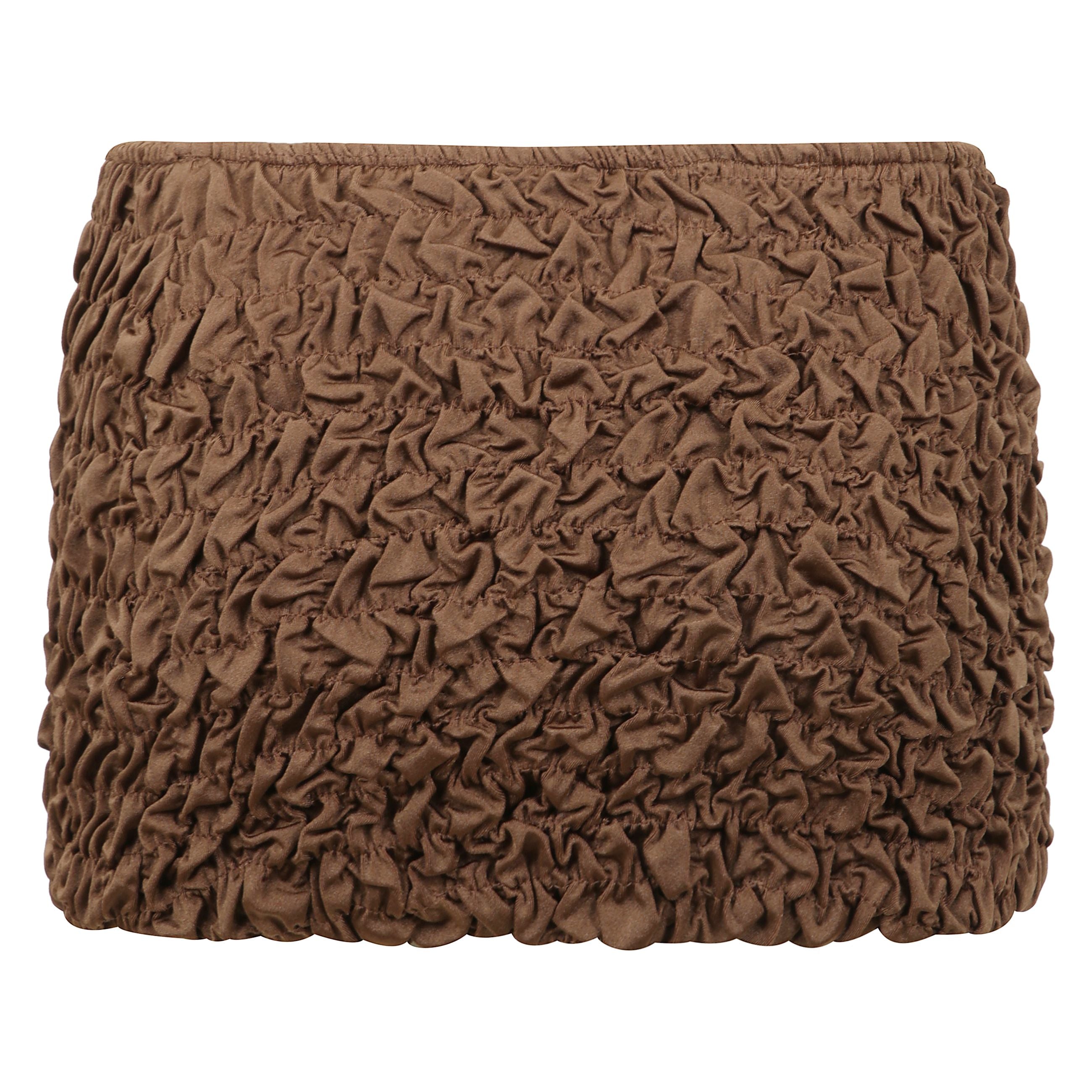 La mini gonna da spiaggia lia Ã¨ realizzata in tessuto shirring per un drappo perfettamente  lussuoso.