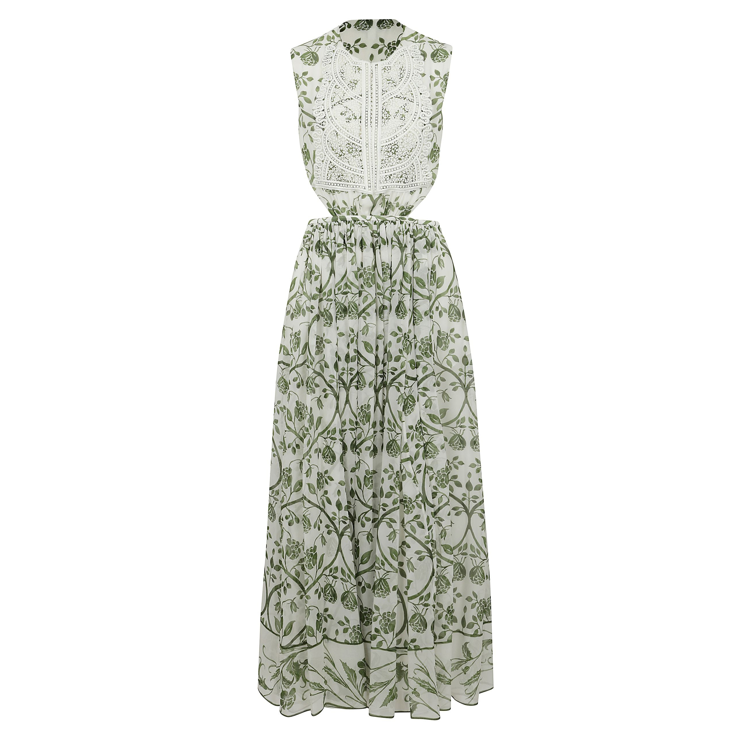 Questo abito avorio e verde con schiena nuda in georgette presenta la stampa fresco. eâ€™ aperto sui lati ha una fodera e la cerniera laterale nascosta.