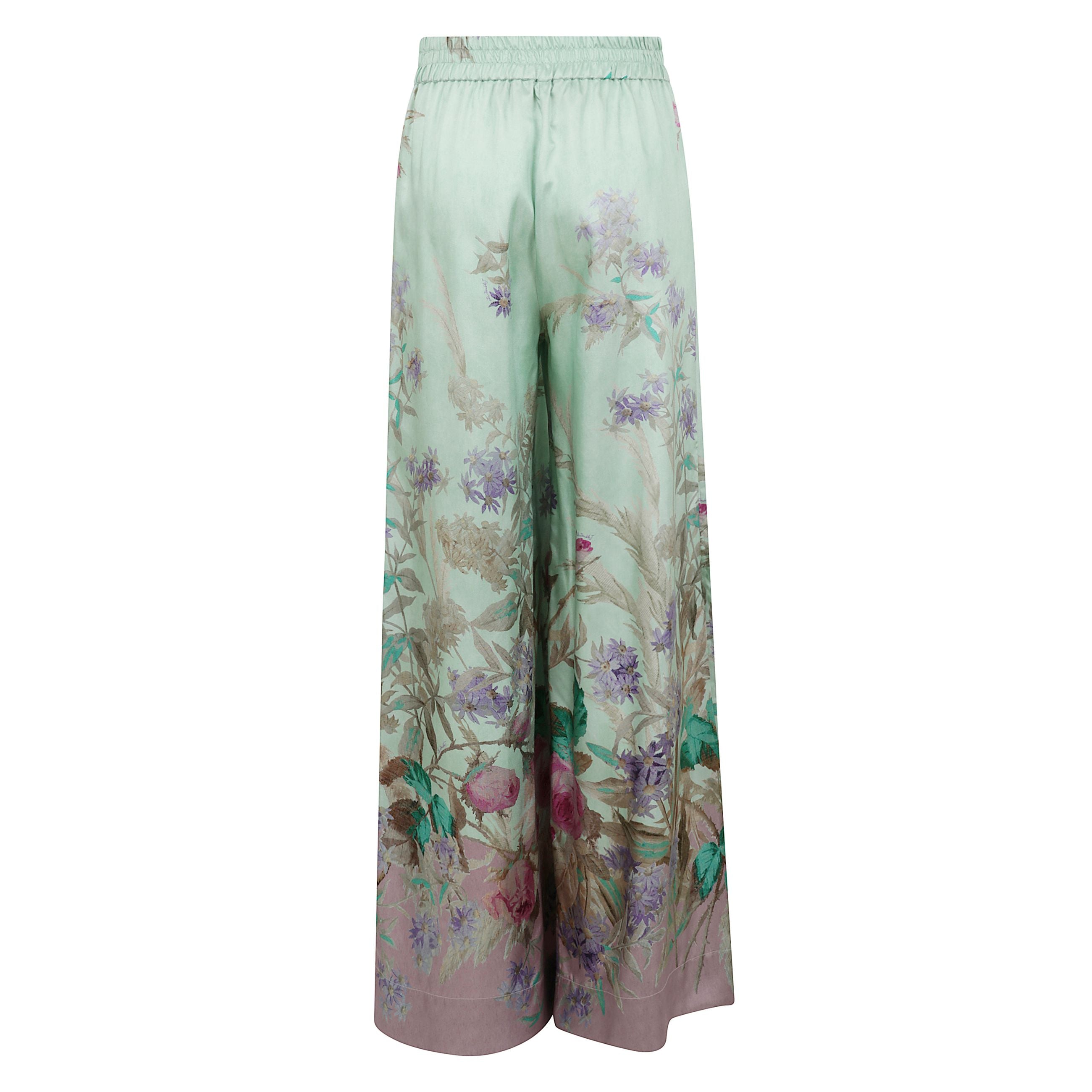 Pantaloni a palazzo con fantasia floreale.
