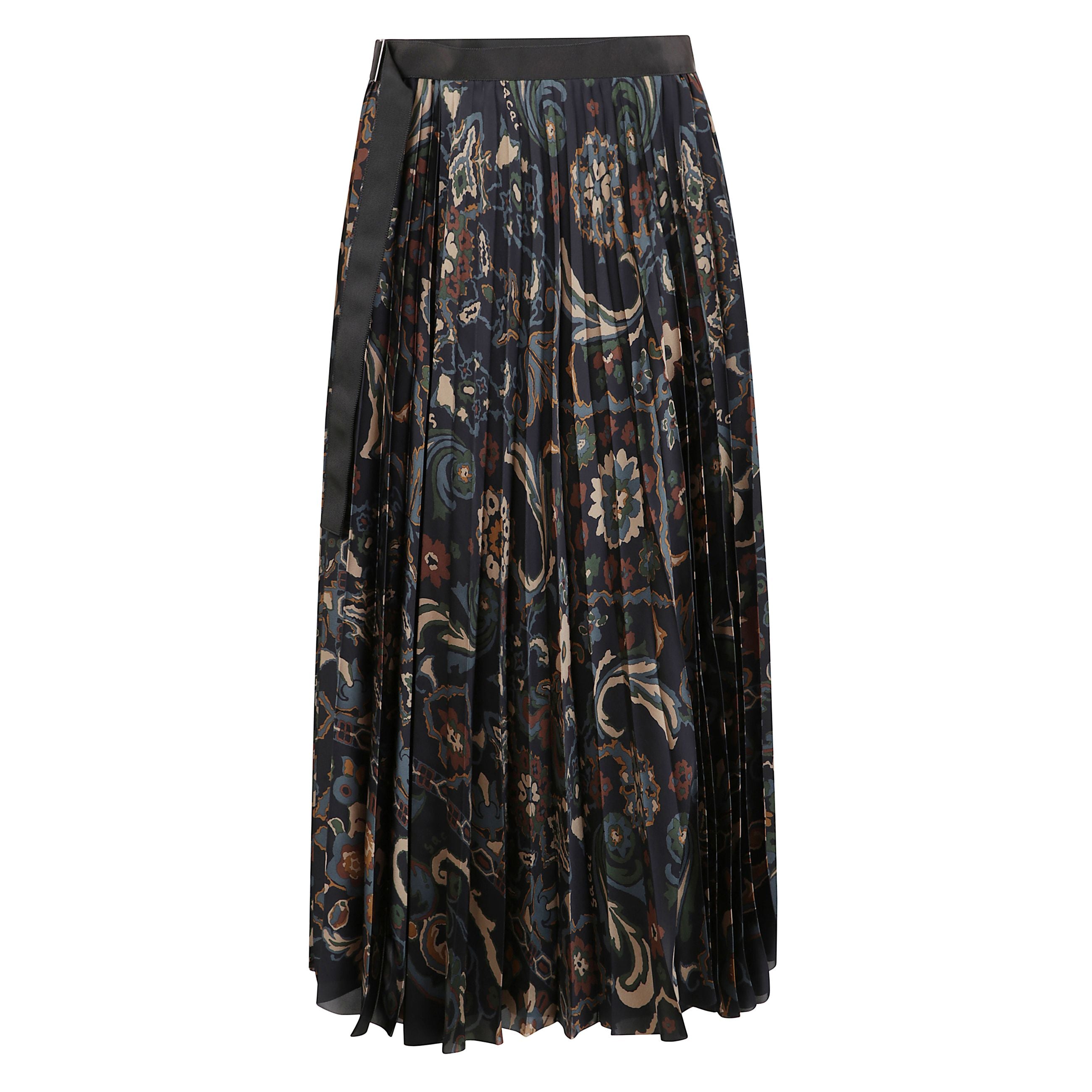 Gonna lunga plissettata con stampa floreale. vita alta con fascia in tessuto. chiusura laterale con nastro.