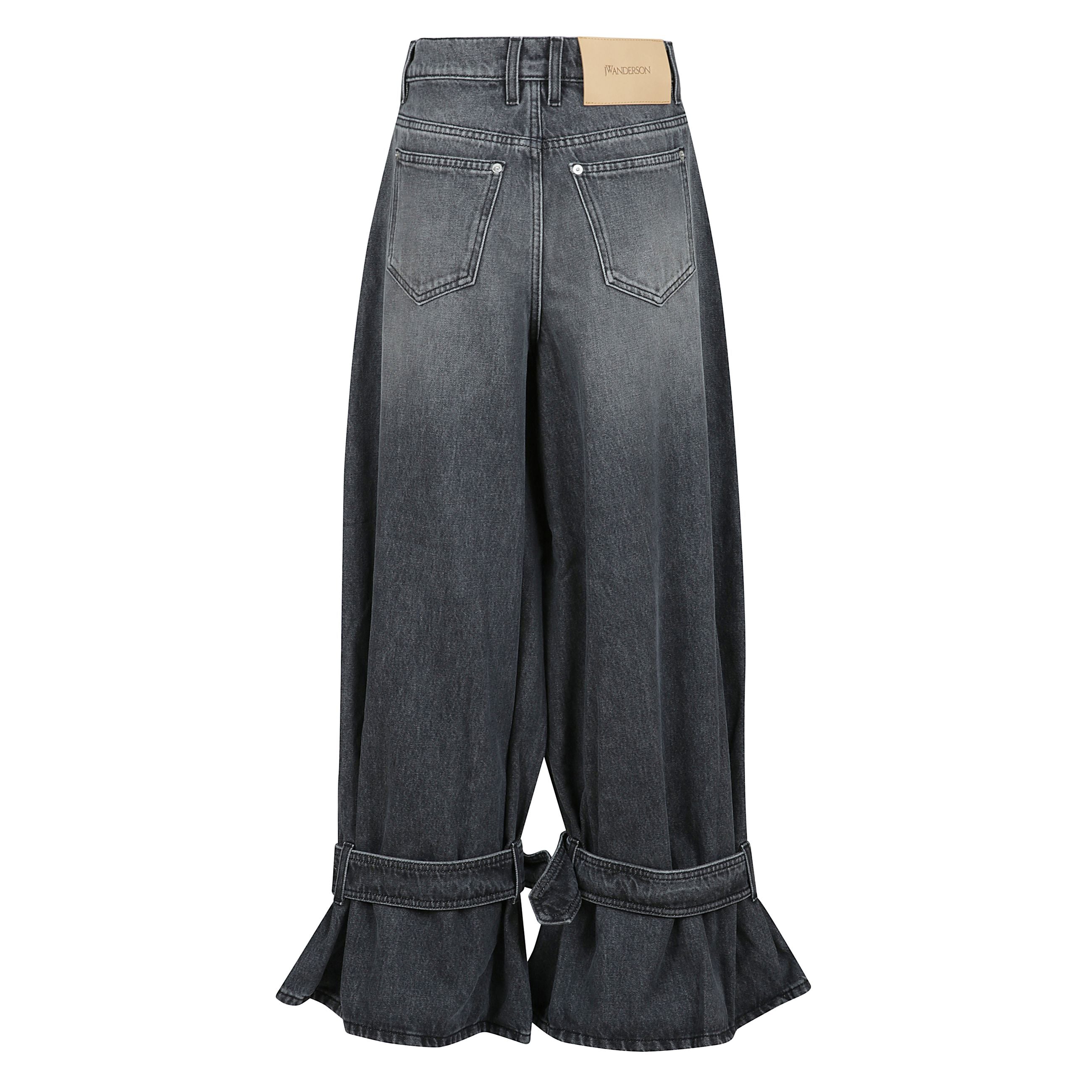 Buckled cuff jeans a gamba larga con chiusura frontale con bottone e cerniera nascosta