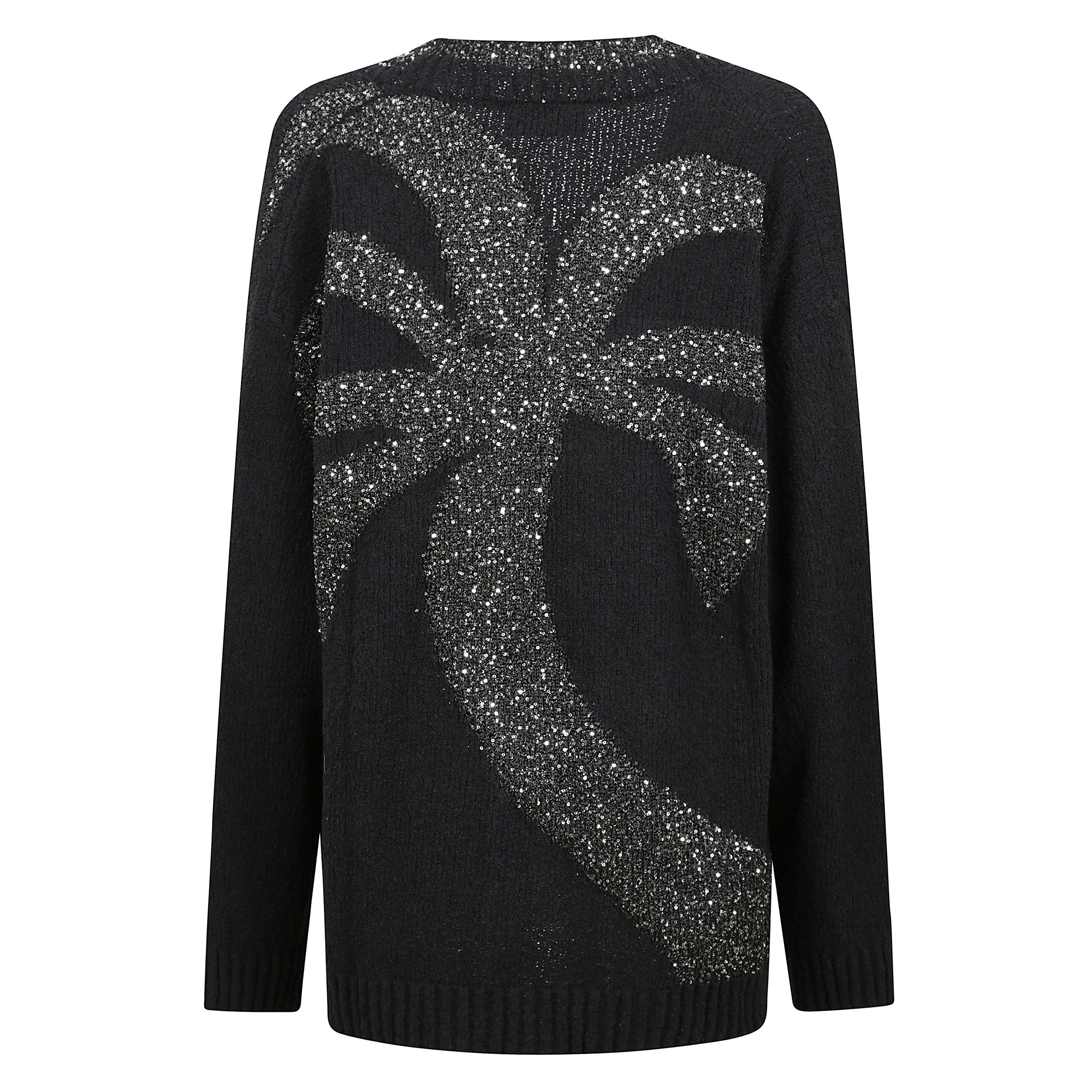 Questo cardigan presenta una silhouette boxy con chiusura frontale senza bottoni e tasche a toppa. impreziosito da un ricamo jacquard con filo di paillettes sul retro.