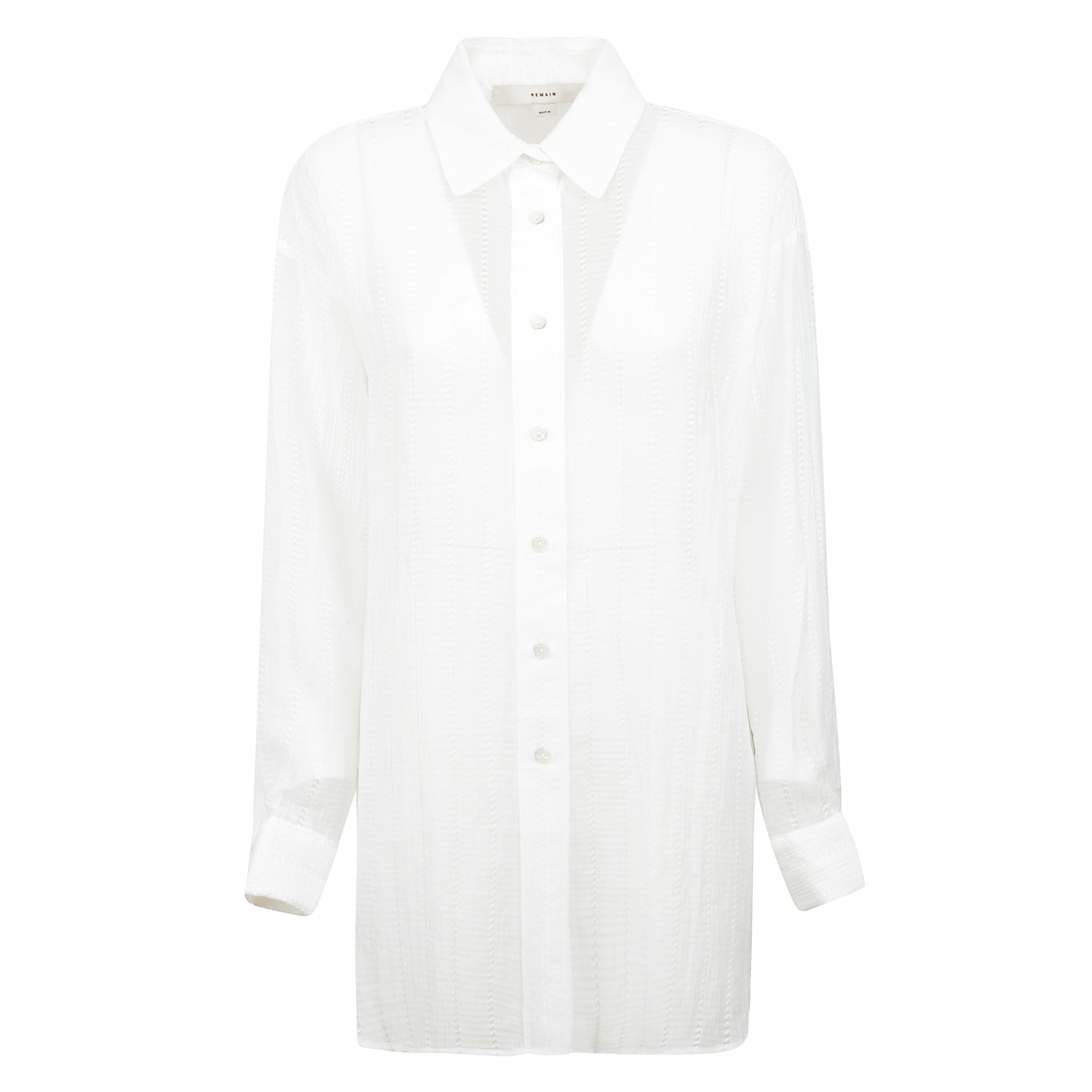 Camicia oversize dal design traforato, chiusura frontale con abbottonatura e polsini con bottoni