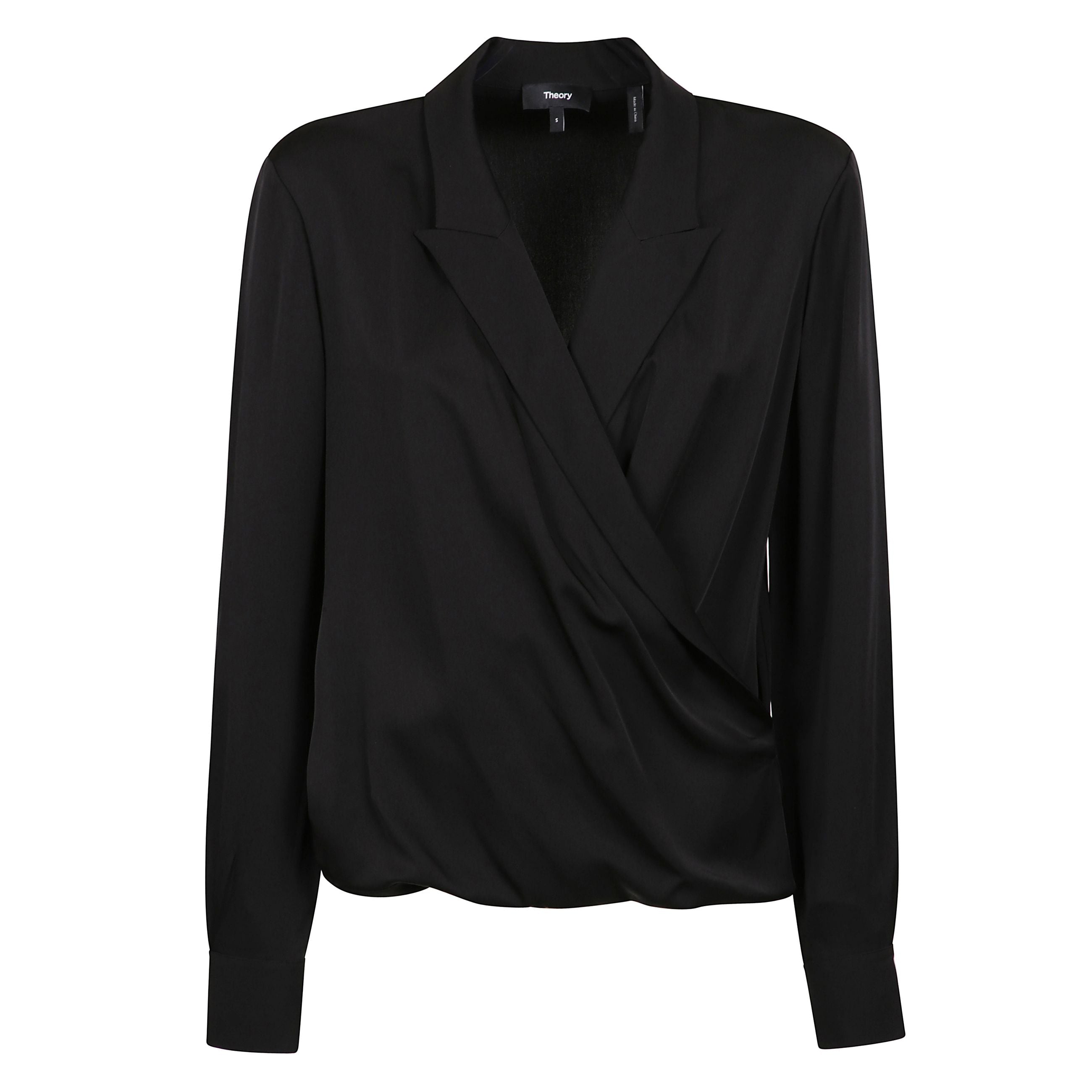 Blusa nera a maniche lunghe con revers a lancia