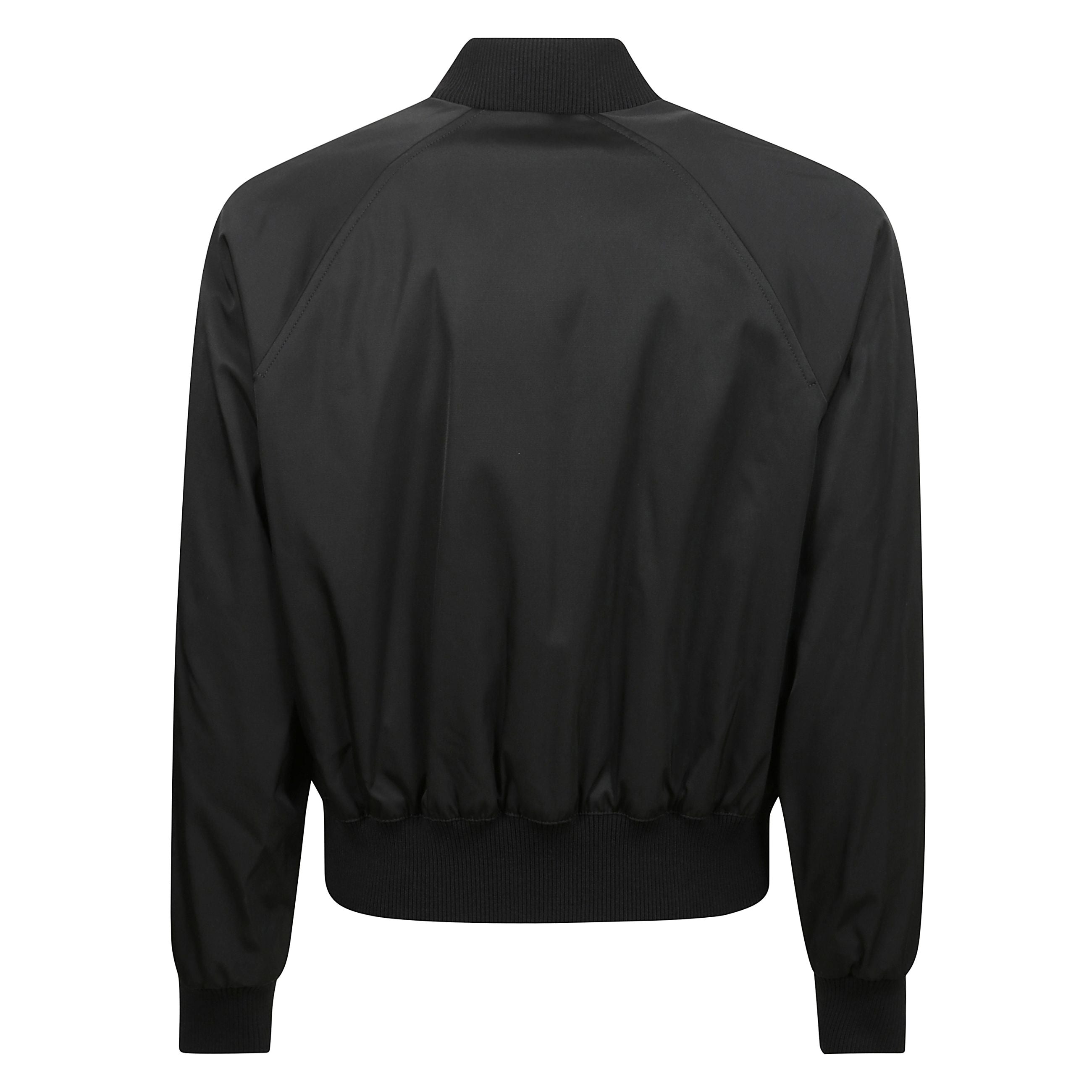 Giubbotto bomber in twill tecnico di nylon e cotone completamente foderato con cerniera doppia in metallo, 
tasche a filetto con bottoni automatici invisibili