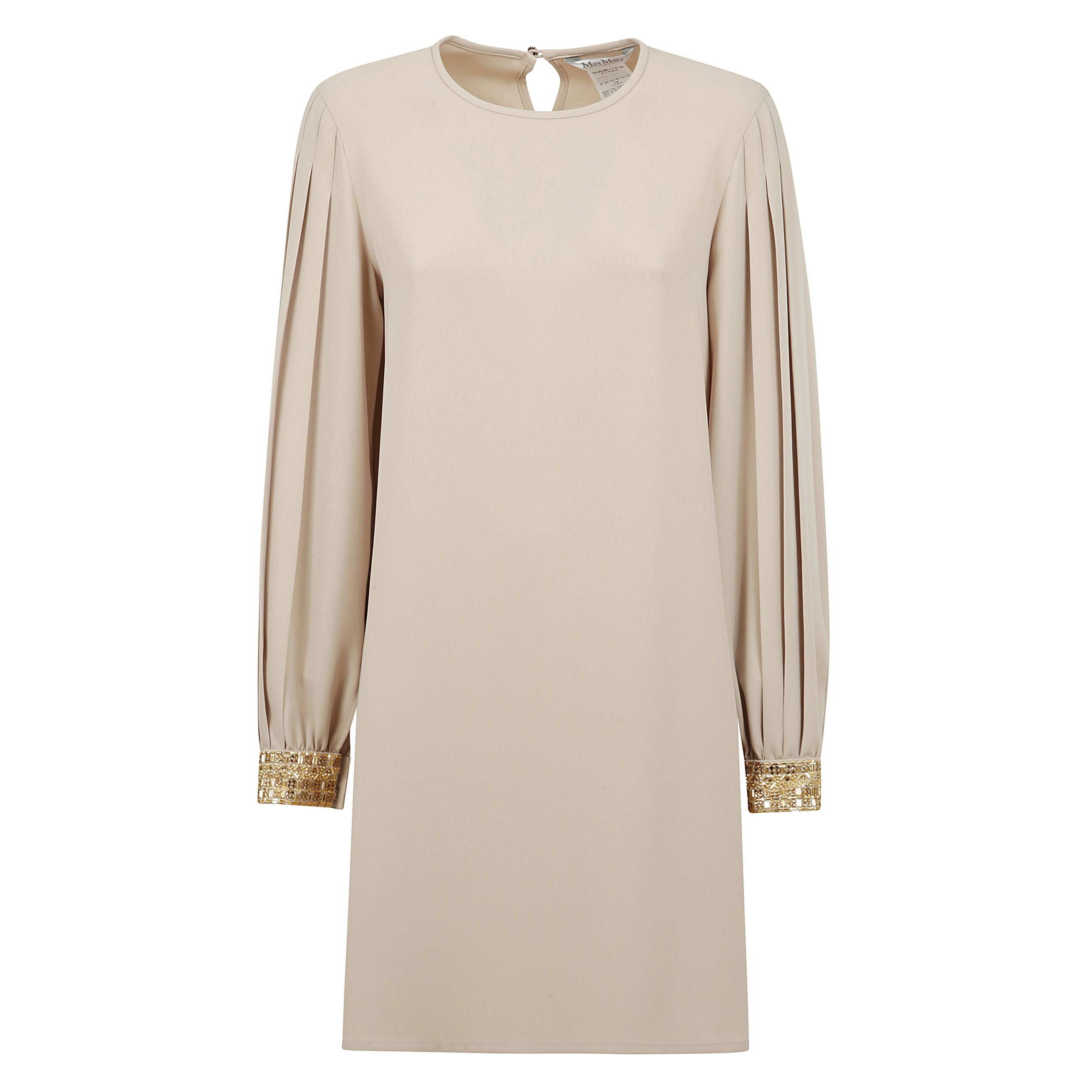 Blusa lunga in cady. presenta maniche lunghe e ampie con motivo a pieghe e polsini con applicazioni di strass. completata da profondi spacchi quadrati sui lati e chiusura a goccia sul retro con bottone gioiello.