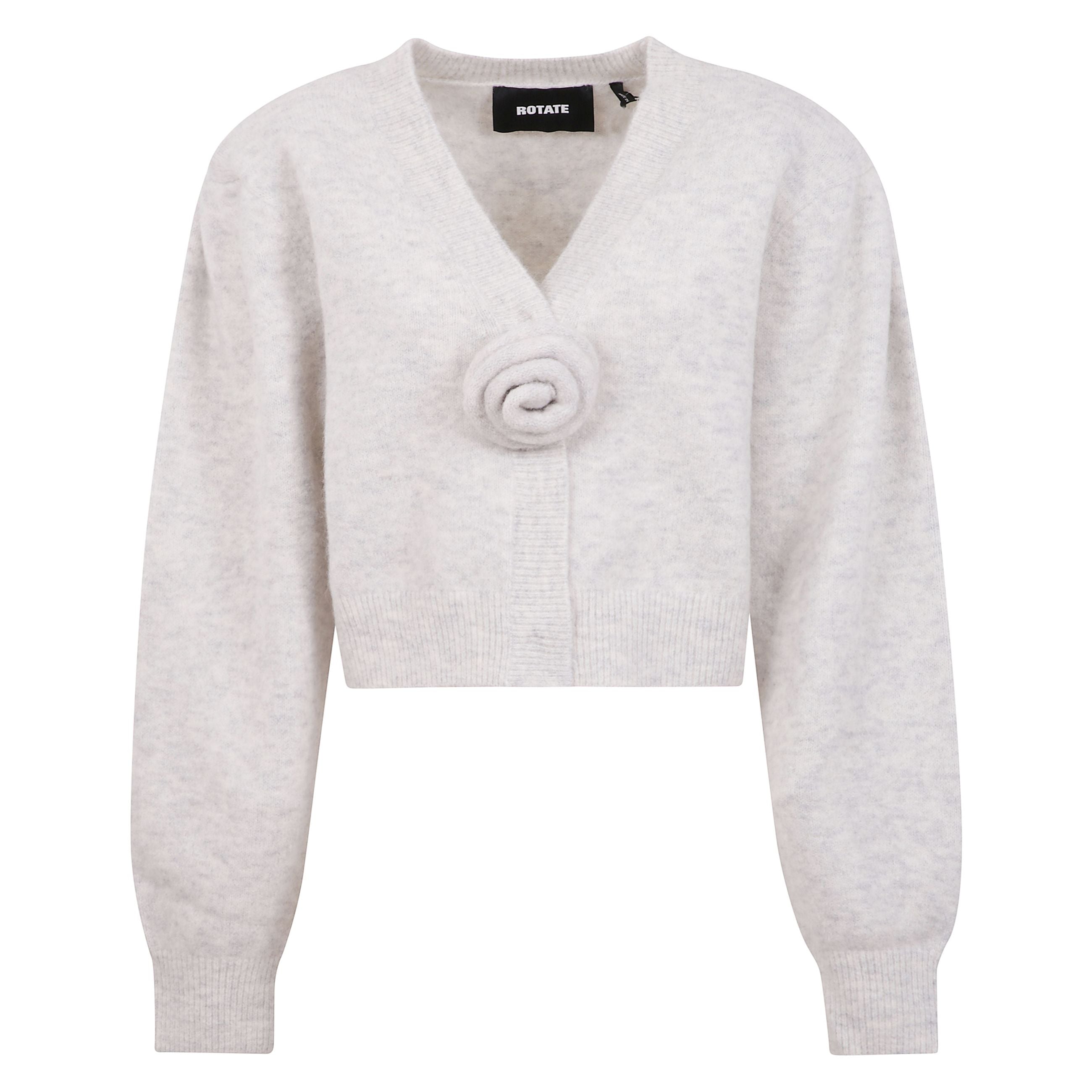 Cardigan in maglia con maniche a sbuffo e scollatura a v. silhouette corta con polsini aderenti e orlo a coste. spalle arricciate e spalline removibili. decorazione in maglia rosa rimovibile al centro davanti.