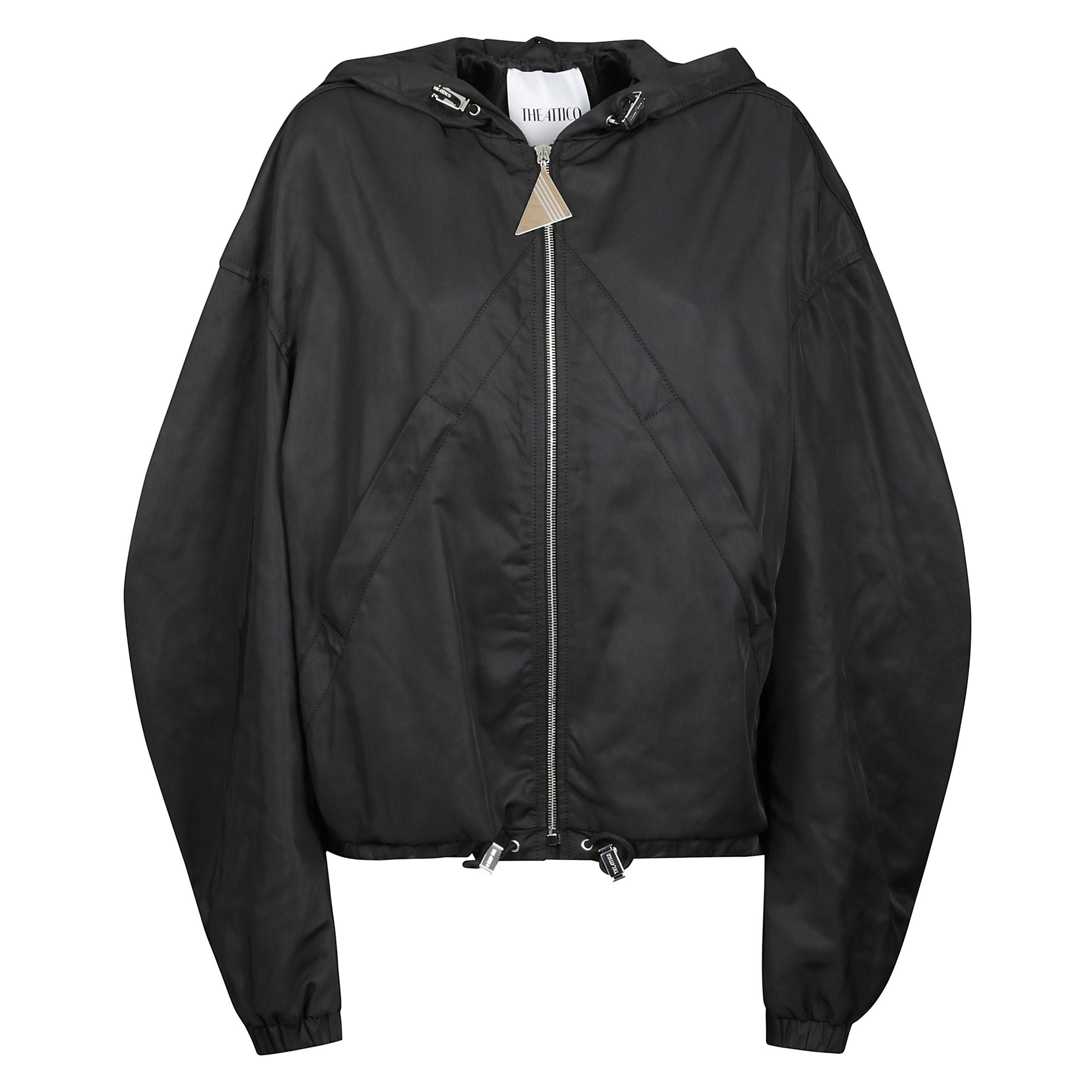 La giacca bomber oversize di the attico rappresenta il perfetto equilibrio tra stile urbano e sofisticatezza contemporanea. caratterizzata da un design avvolgente con linee geometriche e dettagli sartoriali, questa giacca Ã¨ realizzata in tessuto tecnico 