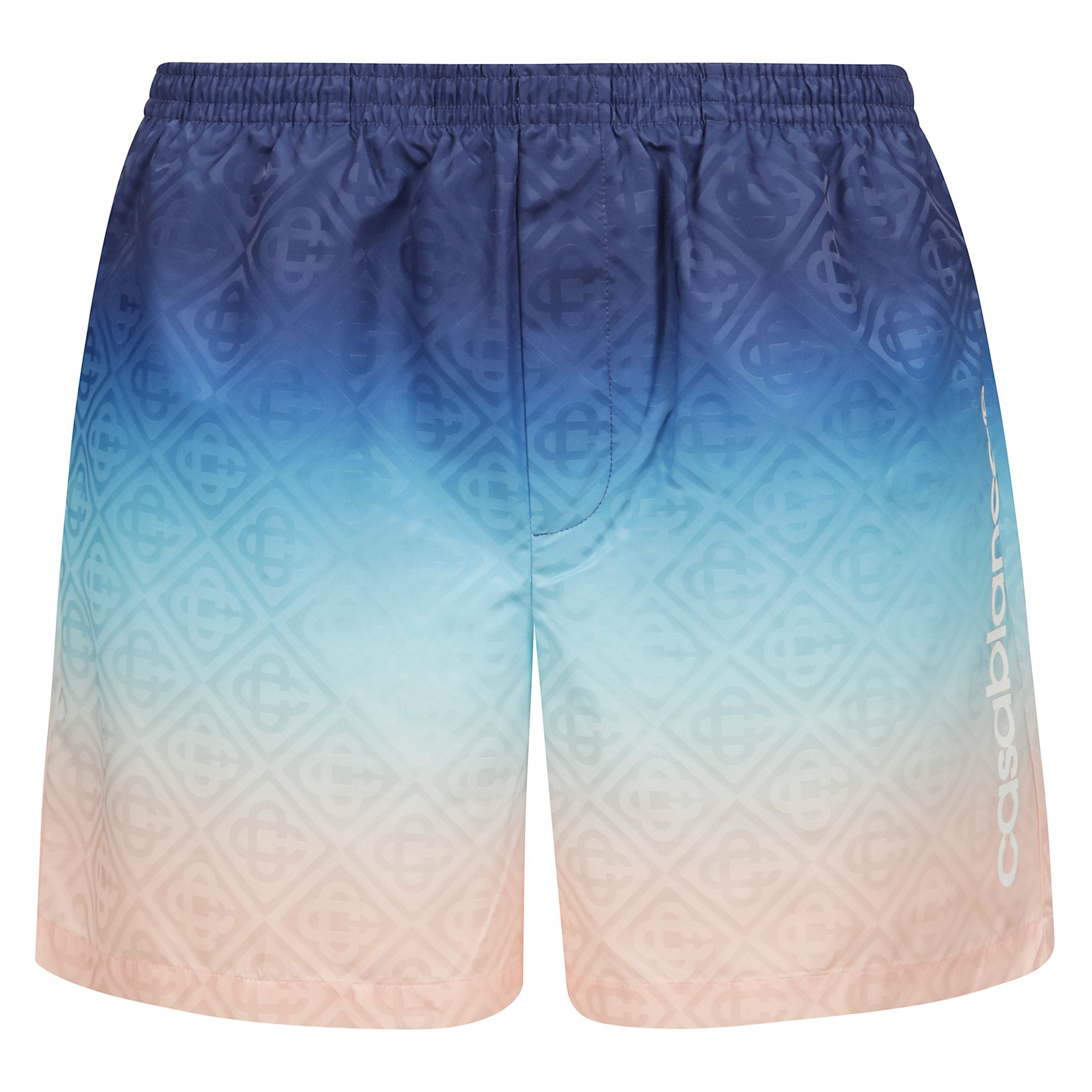 Cintura elasticizzata blu navy con coulisse interna, due tasche laterali inserite, stampa del logo sul davanti. ricordatevi di provare il costume da bagno sopra i vostri indumenti.