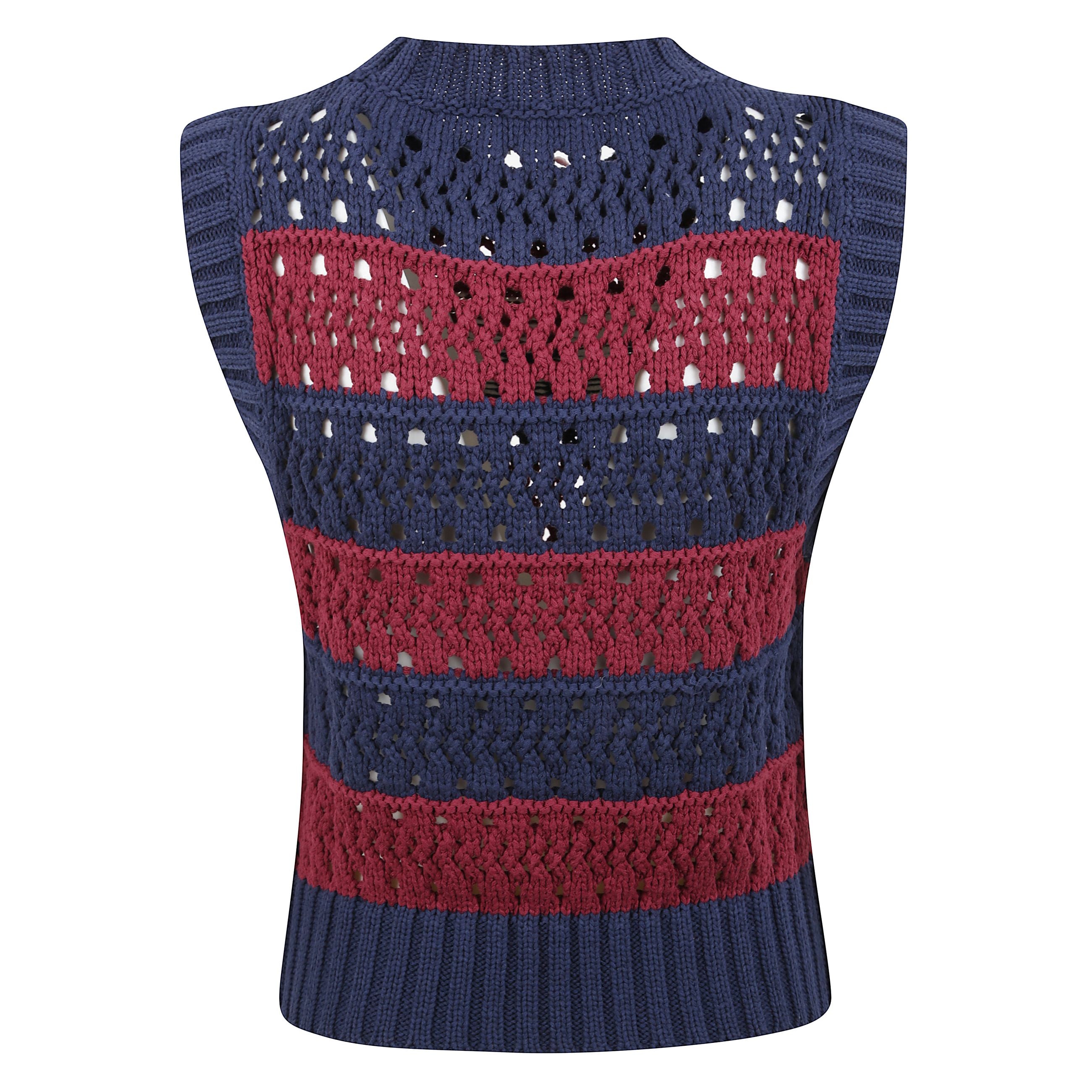 Maglia smanicata con scollo rotondo a costine. motivo a righe orizzontali. finiture a costine. firma ganni sul fronte.