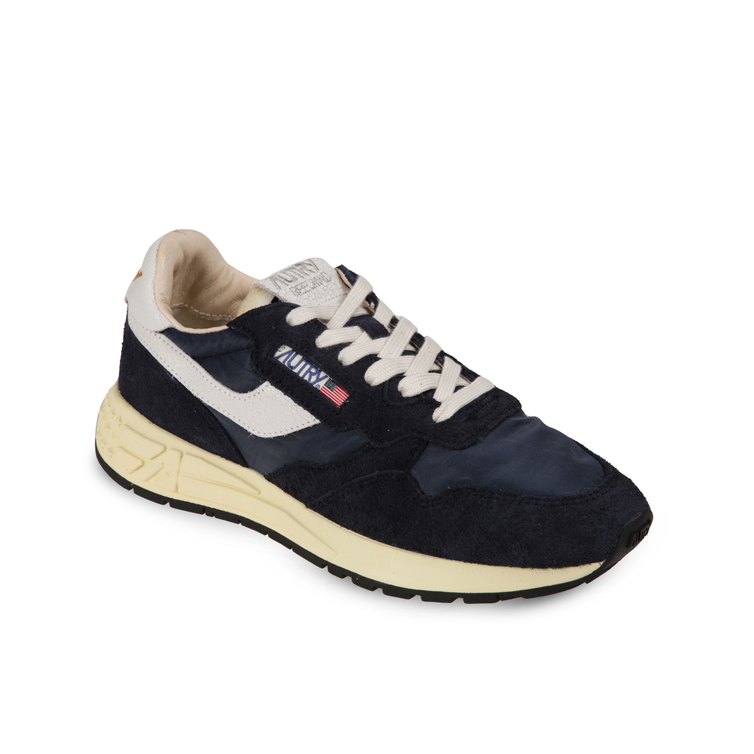 Sneakers autry reelwind. struttura in pelle e nylon con inserti in suede. talloncino ed inserti laterali in pelle con lieve effetto vintage.