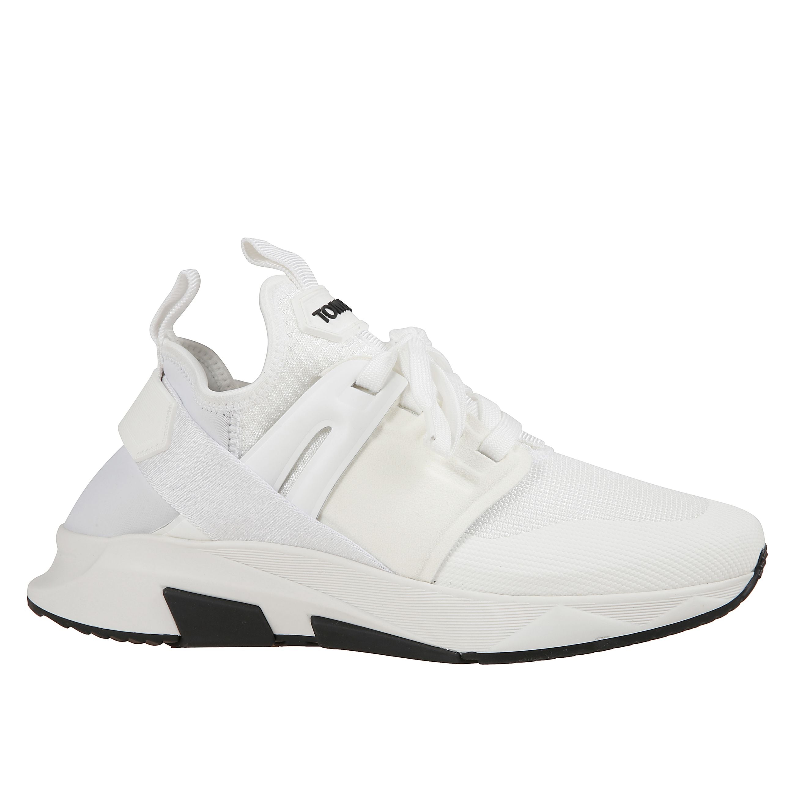 Sneaker con punta tonda e caviglia low top elasticizzata. suola in gomma nera e doppio tirante come dettaglio applicato. fantasia tinta unita bianca con logo tom ford sulla linguetta.