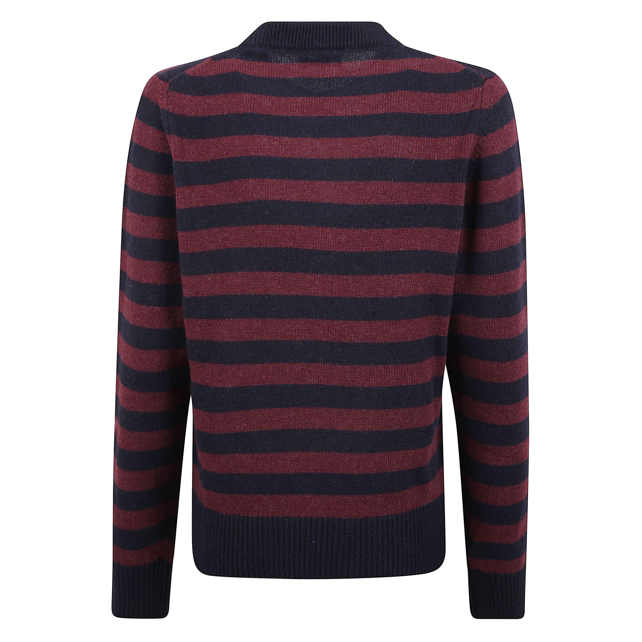Maglia a maniche lunghe in lana. girocollo con polsini a costine e orlo dritto. fantasia a righe bicolore. stampa frontale con barboncino e firma ganni.