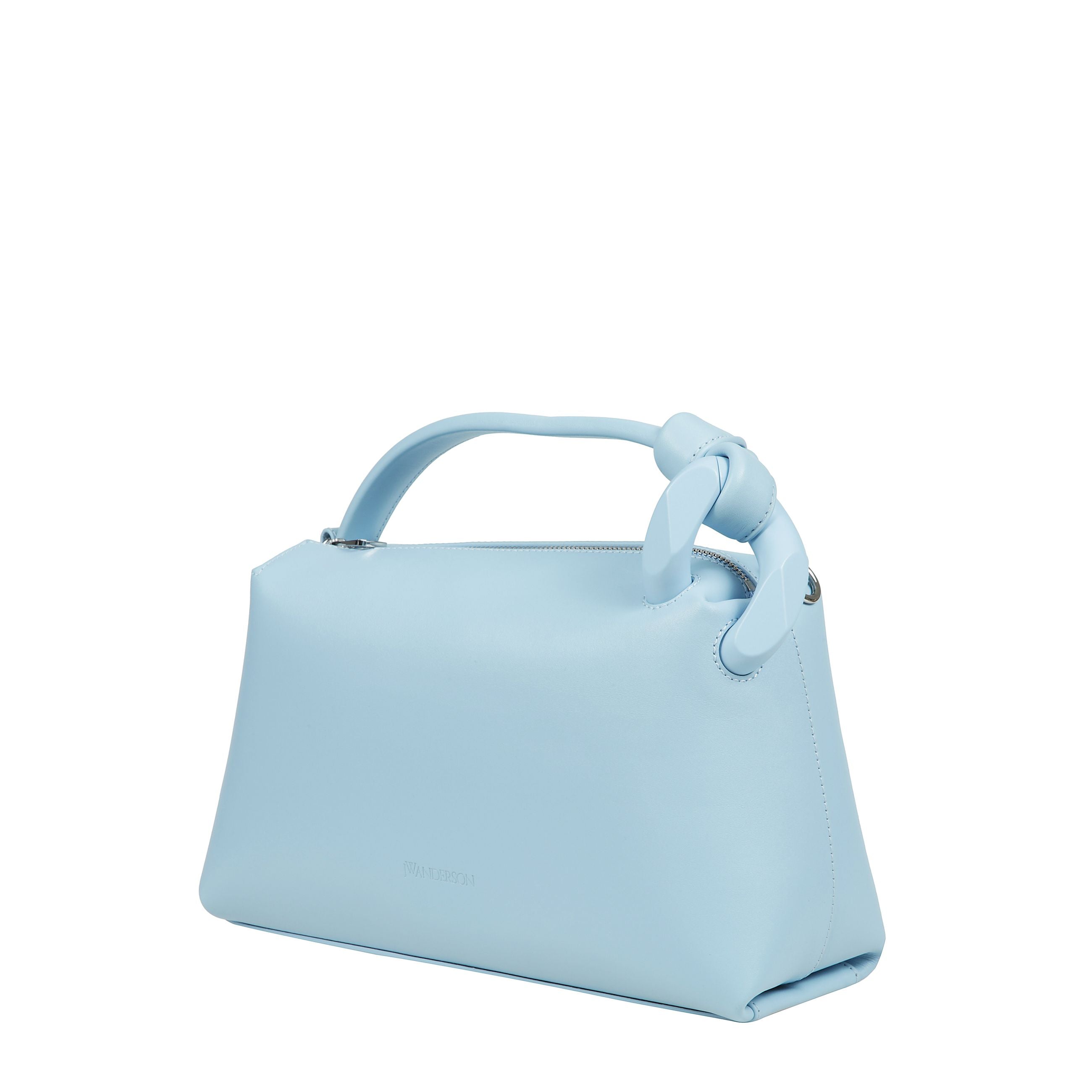 La borsa jw anderson jwa corner Ã¨ realizzato in spagna in pelle di vitello e dispone di un rivestimento in cotone. la borsa ha una tracolla e maniglia superiore. misura 28cm in larghezza, 17cm in altezza e 11cm in profonditÃ , con una cinghia di 52cm.