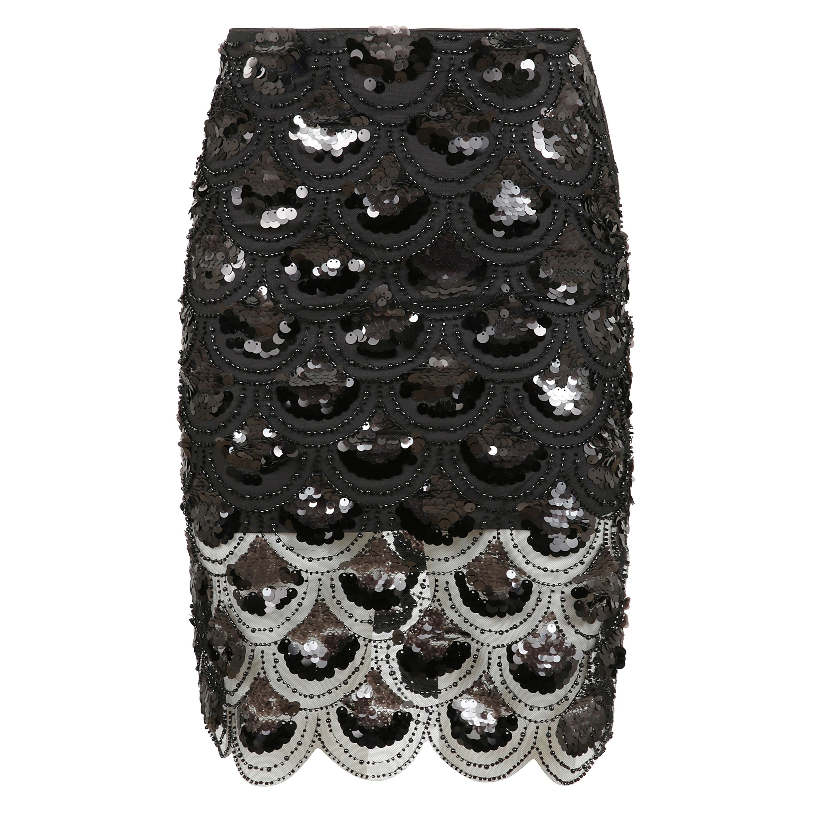 Gonna realizzata in tessuto con paillettes con inserti in pizzo