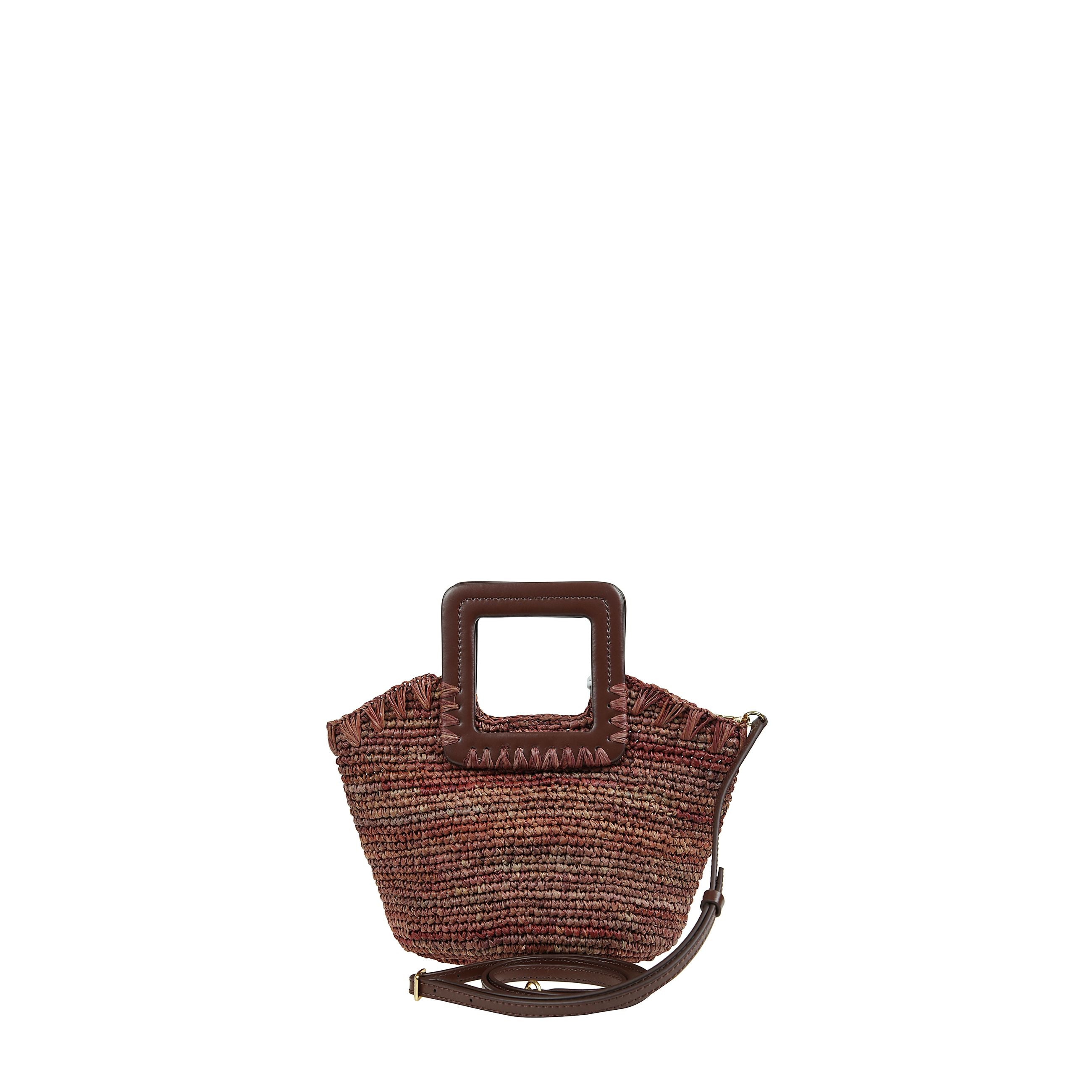 Borsa a mano shirley mini in raffia con chiusura magnetica nascosta e manici corti ha la tracolla regolabile e rimovibile.