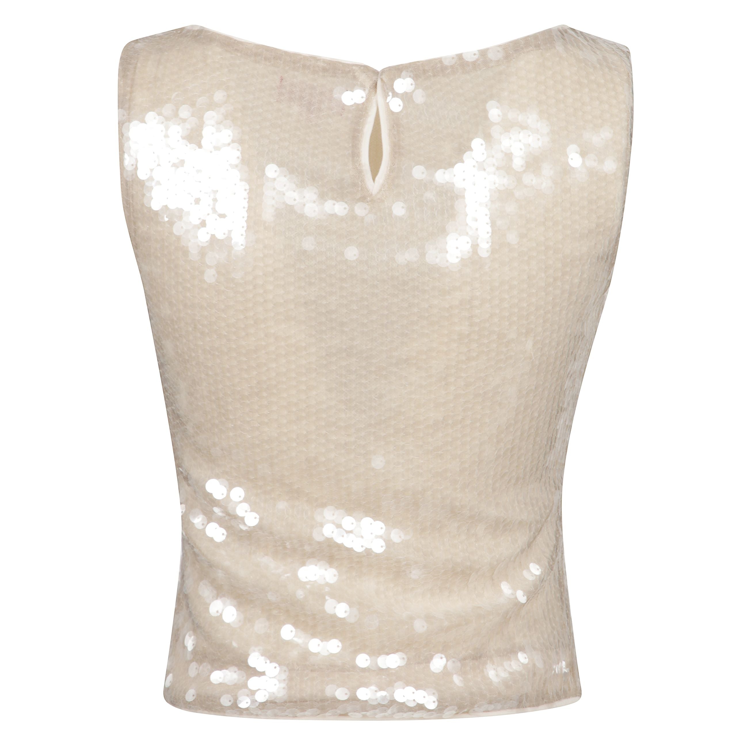 Top con paillettes con chiusura posteriore a bottone singolo
e scollo a barca