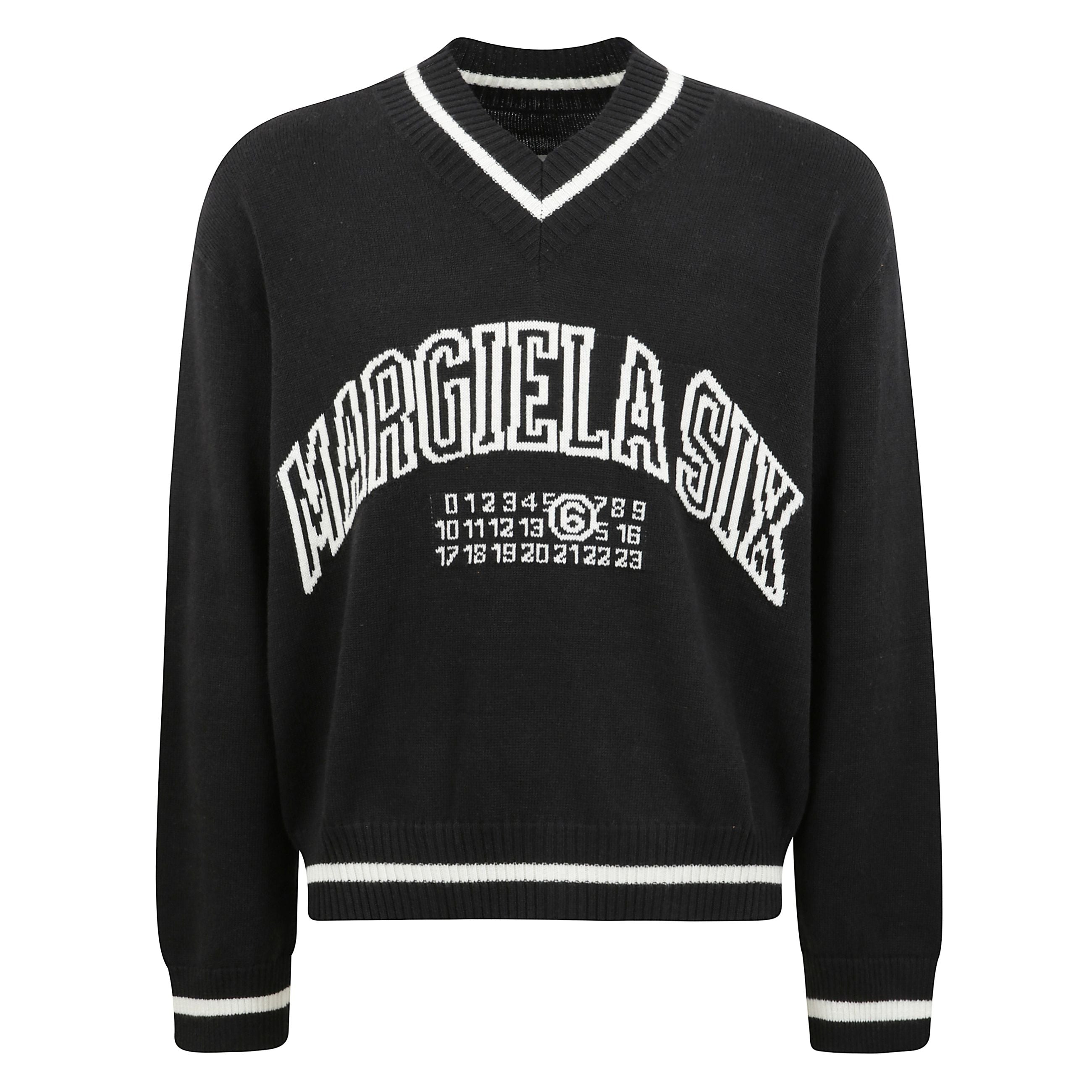 Maglione in misto lana a taglio largo con scollatura a punta.