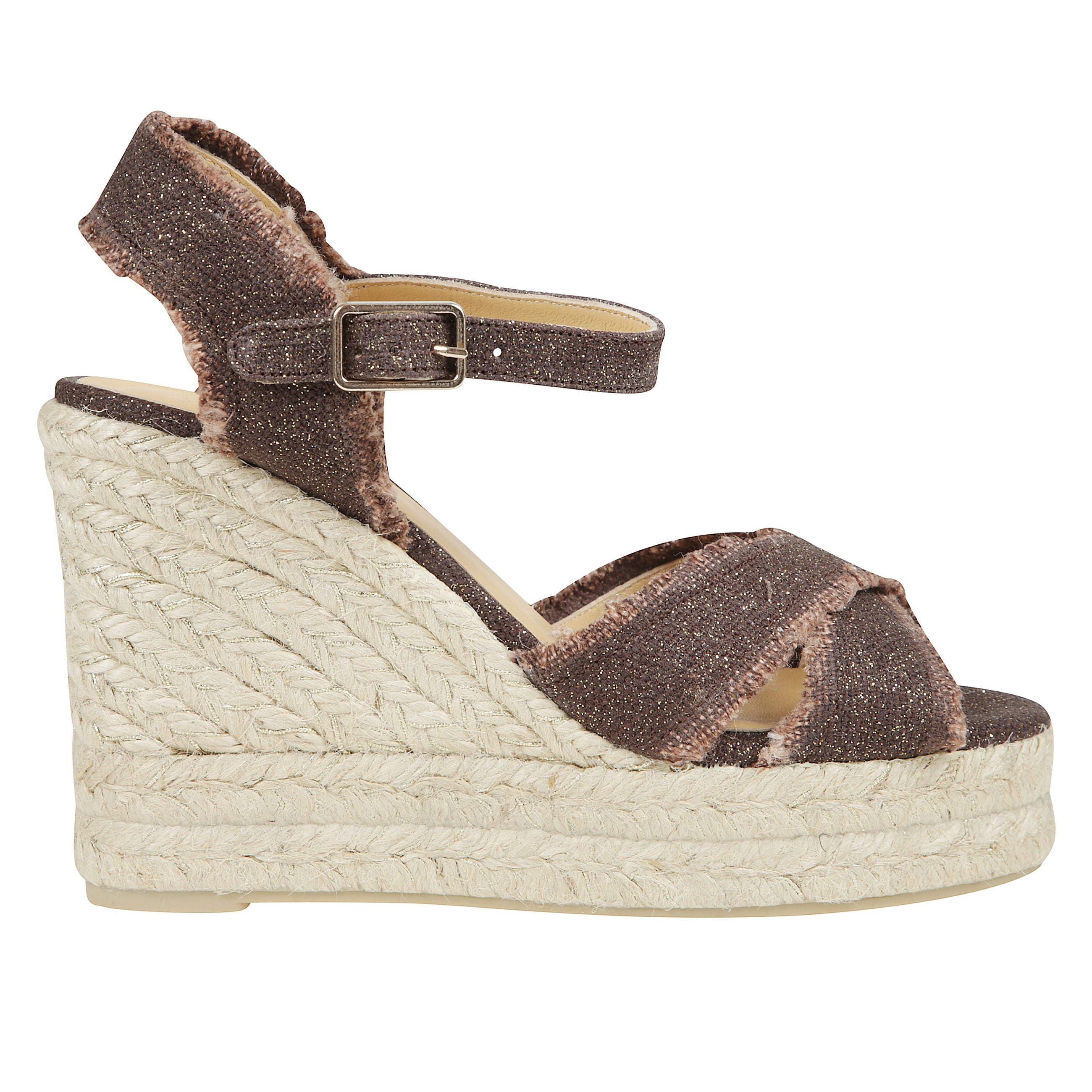Sandalo bromelia in lino metallizzato con taglio incrociato e un vivace effetto sfrangiato. chiusura a cinturino, soletta imbottita e zeppa in juta e lurex di 11 cm con doppio plateau.