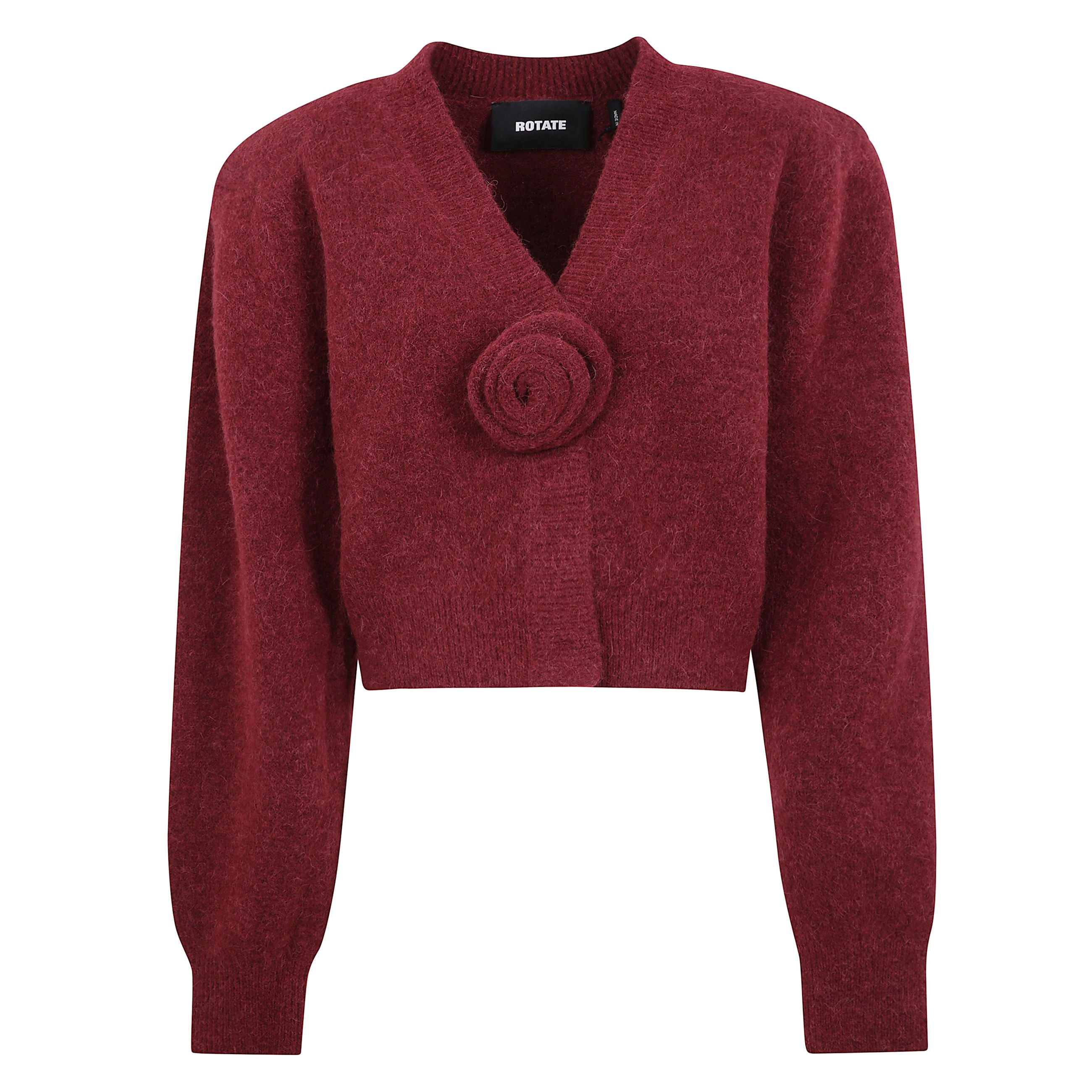 Cardigan in maglia con maniche a sbuffo e scollatura a v. silhouette corta con polsini aderenti e orlo a coste. spalle arricciate e spalline removibili. decorazione in maglia rosa rimovibile al centro davanti.